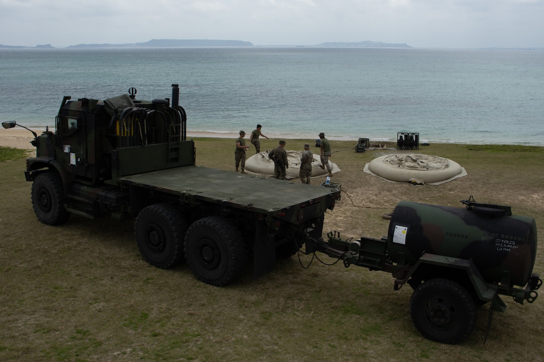 U.S. Marines with Combat Logistics Battalion 31, 31st Marine Expeditionary Unit, arrive to a water purification site during a combat service support area exercise at Kin Blue, Okinawa, Japan, Feb. 9, 2023. A CSSA provides Marines on the ground with food, water, and fuel to support the mission and sustain an area of operations. The 31st MEU is operating aboard ships of USS America Amphibious Ready Group in the 7th fleet area of operations to enhance interoperability with allies and partners and serve as a ready response force to defend peace and stability in the Indo-Pacific region. (U.S. Marine Corps photo by Cpl. Christopher R. Lape)
