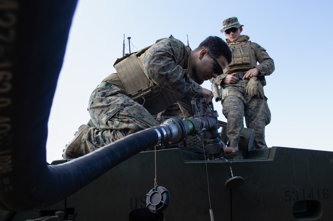 U.S. Marine Corps LCpl. Josiah Moreno, a light armored vehicle-25 driver with Battalion Landing Team 1/4, 31st Marine Expeditionary Unit, refuels a LAV during a combat service support area exercise on Camp Hansen, Okinawa, Japan, Feb. 8, 2023. A CSSA provides Marines on the ground with food, water, and fuel to support the mission and sustain an area of operations. The 31st MEU is operating aboard ships of USS America Amphibious Ready Group in the 7th fleet area of operations to enhance interoperability with allies and partners and serve as a ready response force to defend peace and stability in the Indo-Pacific region. (U.S. Marine Corps photo by Cpl. Christopher R. Lape)