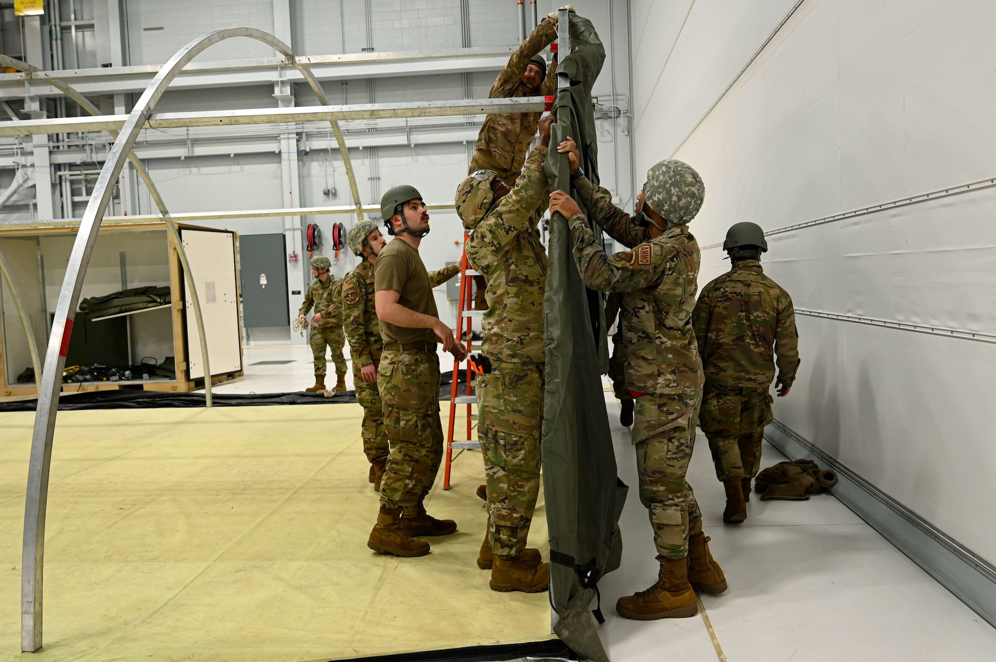 Airmen build a tent