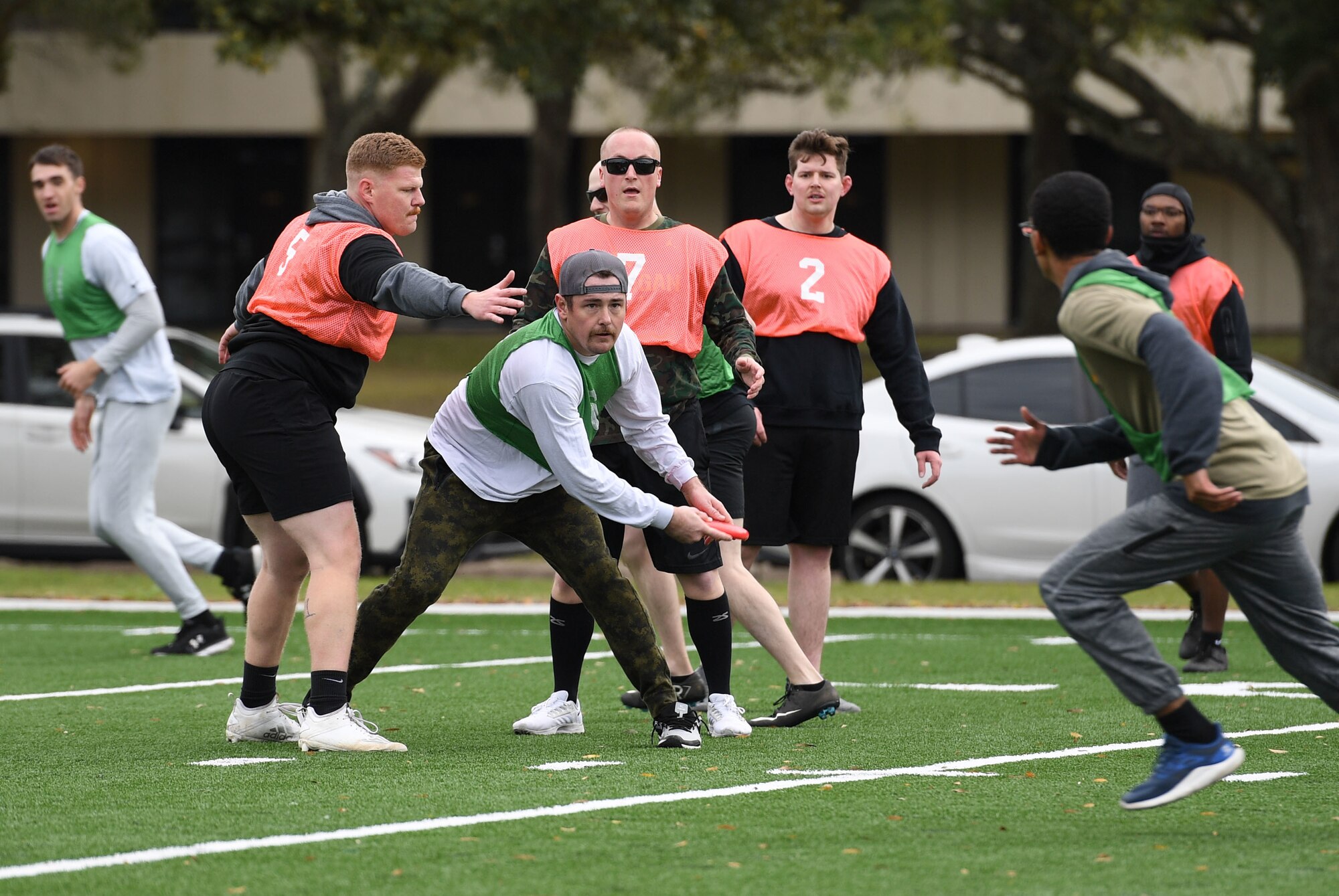 Members of the 338th Training Squadron and the 81st Security Forces Squadron participate in an ultimate frisbee tournament following the turf field ribbon cutting ceremony at Keesler Air Force Base, Mississippi.