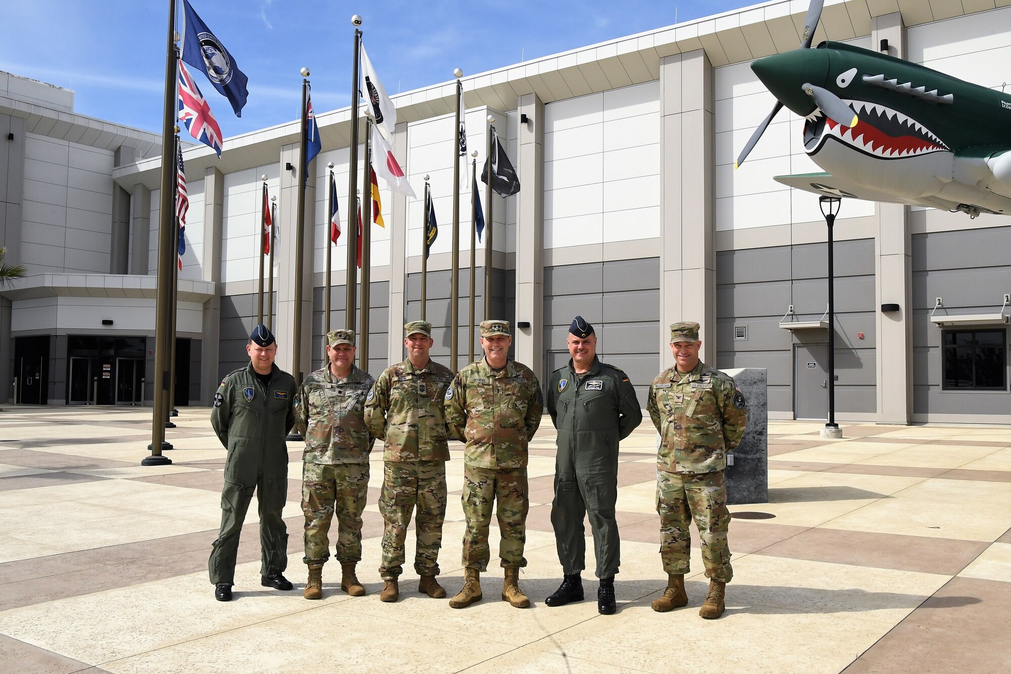 Visitors from the North Atlantic Treaty Organization (NATO) Headquarters, including German Air Force Brig. Gen. Christoph Pliet, NATO Air Command Deputy Chief of Staff, stand with Combined Force Space Component Command leadership during a visit to CFSCC Headquarters, Feb. 16, 2023. During the visit, the NATO officers had an opportunity to learn more about the CFSCC and Combined Space Operation Center missions, and gain an increased understanding of how the U.S. works with partner nations to maintain Space Domain Awareness. (U.S. Space Force photo by Capt. Erin Leon)