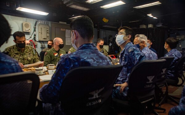 220415-N-YQ181-1016 YOKOSUKA, Japan (April 15, 2022) Vice Adm. FUKUDA Tatsuya, commander, Fleet Escort Force, Japan Maritime Self-Defense Force and Rear Adm. Michael Donnelly, commander, Task Force (CTF) 70, conducts flag talks aboard the U.S. Navy’s only forward-deployed aircraft carrier, USS Ronald Reagan (CVN 76), flagship of Carrier Strike Group (CSG) 5. Flag talks allow commanders to plan for future operations, work through challenges or lessons learned, while building towards greater collaboration when their forces operate together in the maritime environment. CTF 70/CSG 5 is forward-deployed to the U.S. 7th Fleet area of operations in support of a free and open Indo-Pacific (U.S. Navy photo by Mass Communication Specialist 2nd Class Askia Collins)