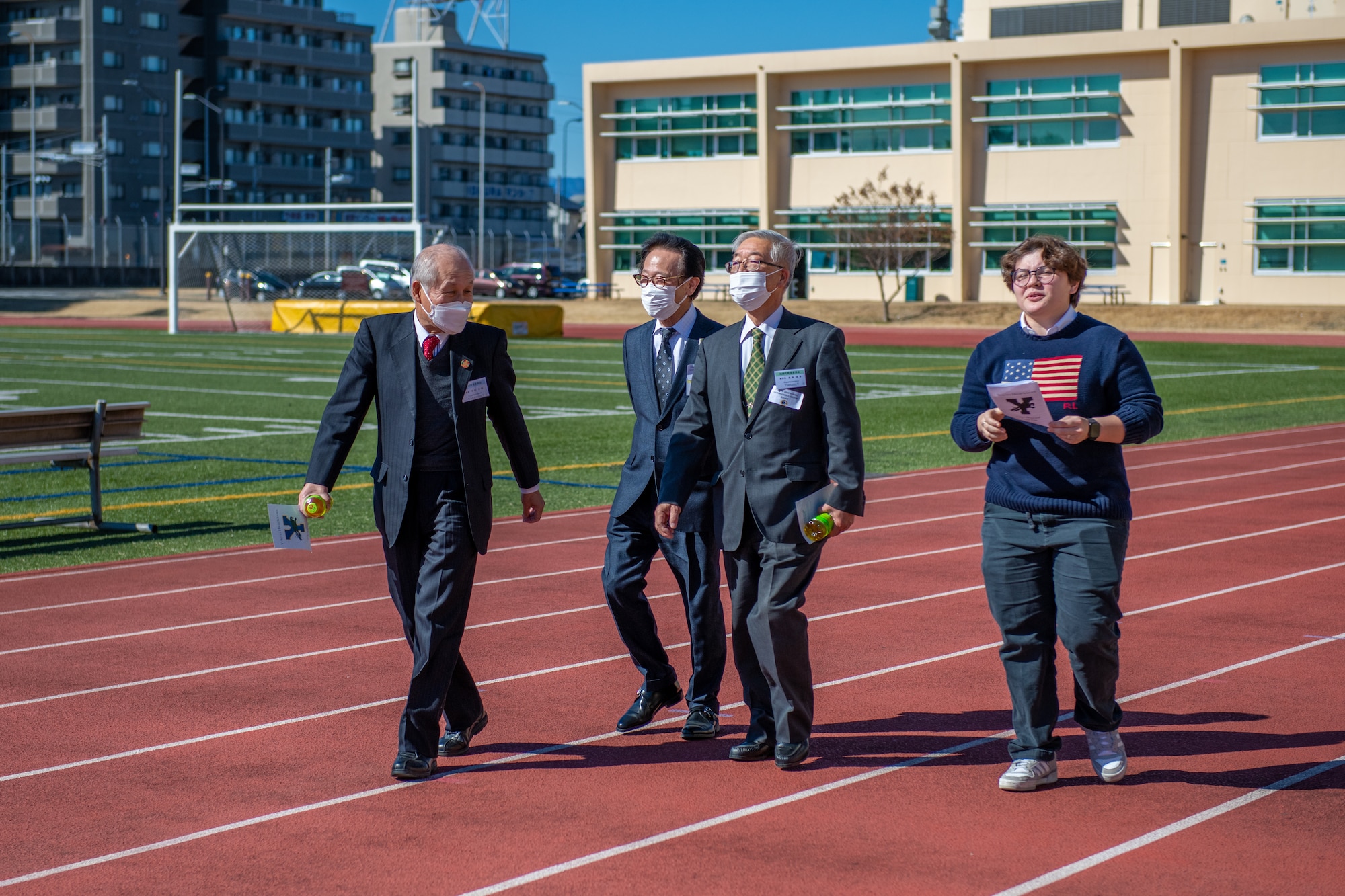 Members of the Japanese Board of Education tour the grounds of Yokota High School during an immersion with Department of Defense Education Activity Pacific East District representatives, Feb. 16, 2023, at Yokota Air Base, Japan.