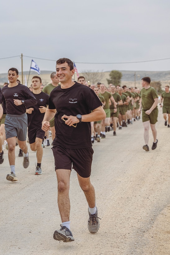 An Israeli soldier with the Israeli Defense Force and U.S. Marines with 2nd Assault Amphibian Battalion, 2nd Marine Division, participate in an integrated physical training event during Intrepid Maven 23.2, in Israel, Feb. 21, 2023. Intrepid Maven is a bilateral exercise between USMARCENT and the IDF designed to improve interoperability, strengthen partner-nation relationships in the U.S. Central Command area of operations and improve both individual and bilateral unit readiness. (U.S. Marine Corps photo by Lance Cpl. Emma Gray)
