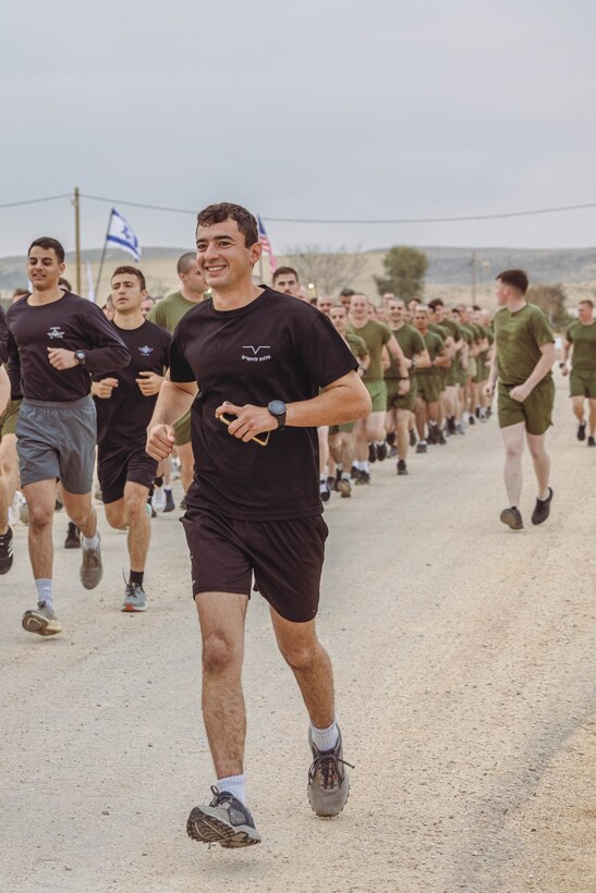 An Israeli soldier with the Israeli Defense Force and U.S. Marines with 2nd Assault Amphibian Battalion, 2nd Marine Division, participate in an integrated physical training event during Intrepid Maven 23.2, in Israel, Feb. 21, 2023. Intrepid Maven is a bilateral exercise between USMARCENT and the IDF designed to improve interoperability, strengthen partner-nation relationships in the U.S. Central Command area of operations and improve both individual and bilateral unit readiness. (U.S. Marine Corps photo by Lance Cpl. Emma Gray)