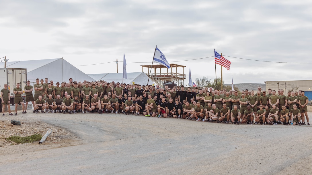 U.S. Marines attached to Marine Corps Forces Central Command with 2nd Assault Amphibian Battalion, 2nd Marine Division, and soldiers with the Israeli Defense Force pose for a photo during Intrepid Maven 23.2, in Israel, Feb. 21, 2023. Intrepid Maven is a bilateral exercise between USMARCENT and the IDF designed to improve interoperability, strengthen partner-nation relationships in the U.S. Central Command area of operations and improve both individual and bilateral unit readiness. (U.S. Marine Corps photo by Lance Cpl. Emma Gray)