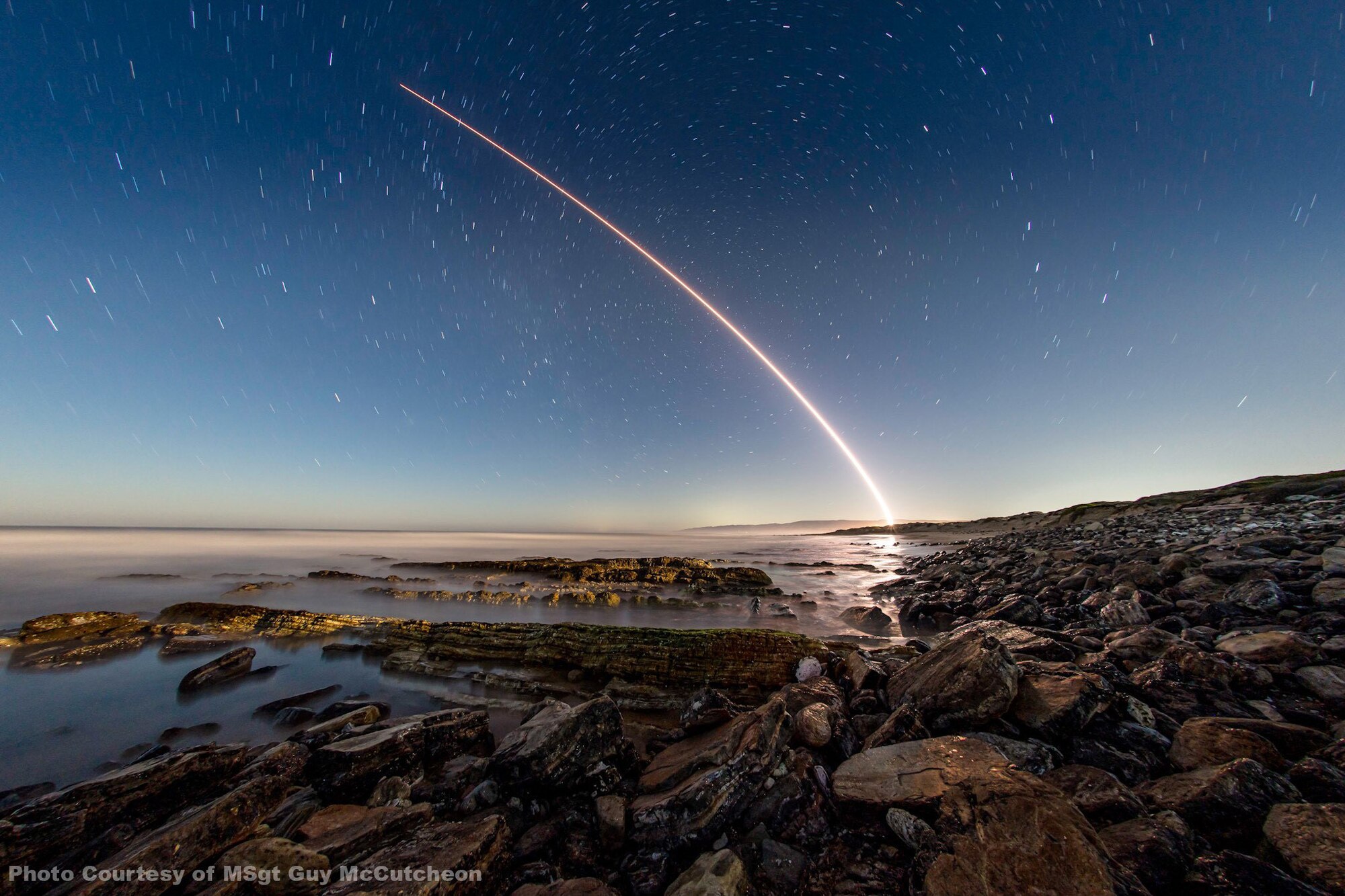 Image of a missile trail in the night sky.