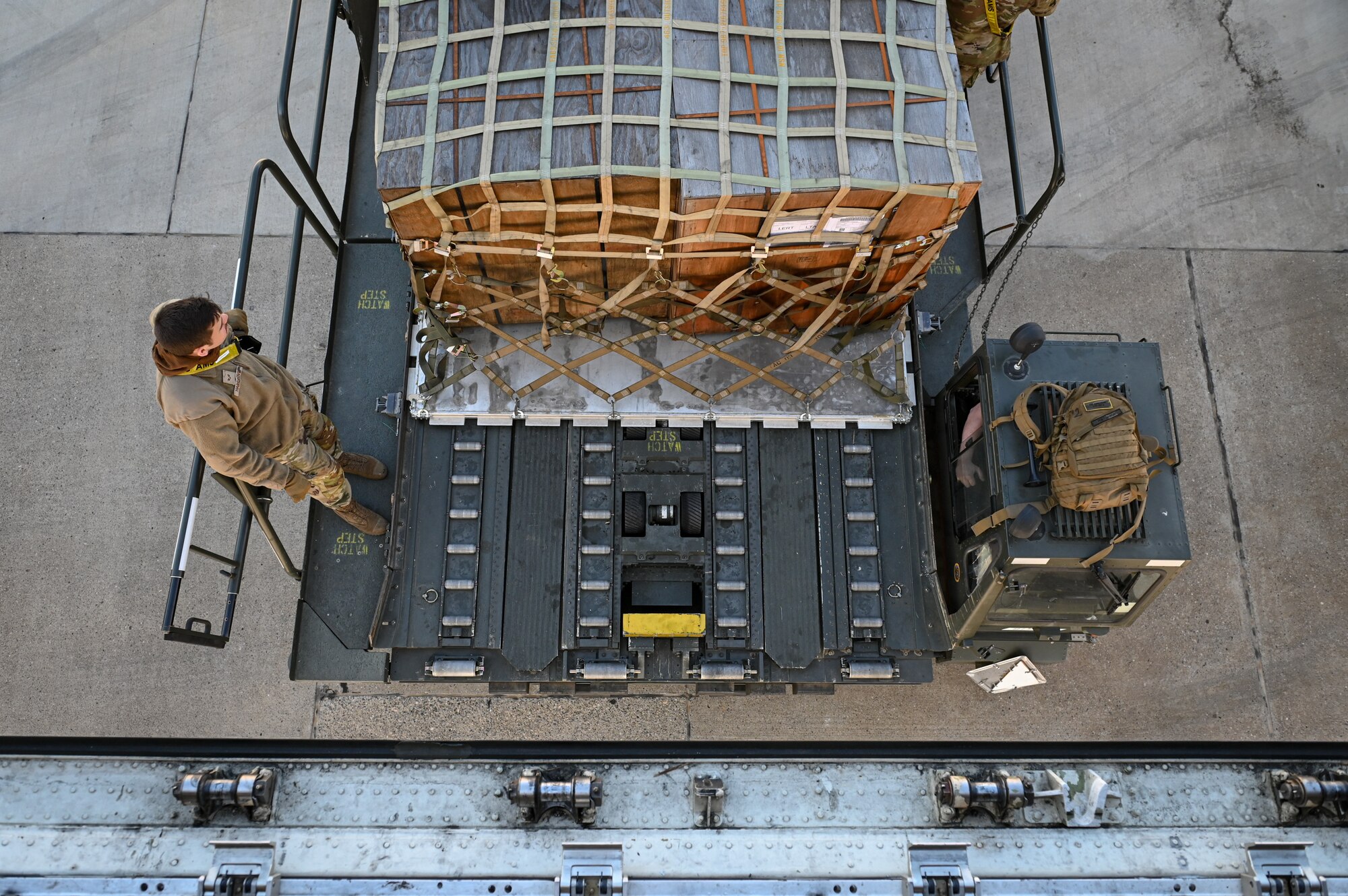 Senior Airman Caleb Hargrove, an air transportation specialist assigned to the 728th Air Mobility Squadron, prepares to unload medical shelters and equipment at Incirlik Air Base, Türkiye, Feb. 18, 2023.