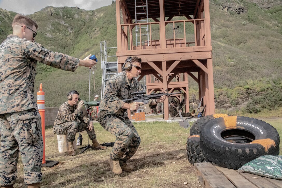 U.S. Marine Corps SSgt. Stephen Corson, pistol team SNCOIC with the Marine Corps Shooting Team, performs a shooting drill during the Marine Corps Marksmanship Competition - Pacific at Crater Range, Marine Corps Base Hawaii, Jan 31, 2023. The MCMC-Pacific is one of four regional competitions throughout the Marine Corps in which U.S. service members and the Pacific's best shooters participate in a small arms marksmanship competition each year. (U.S. Marine Corps photo by Cpl. Holly Moore)