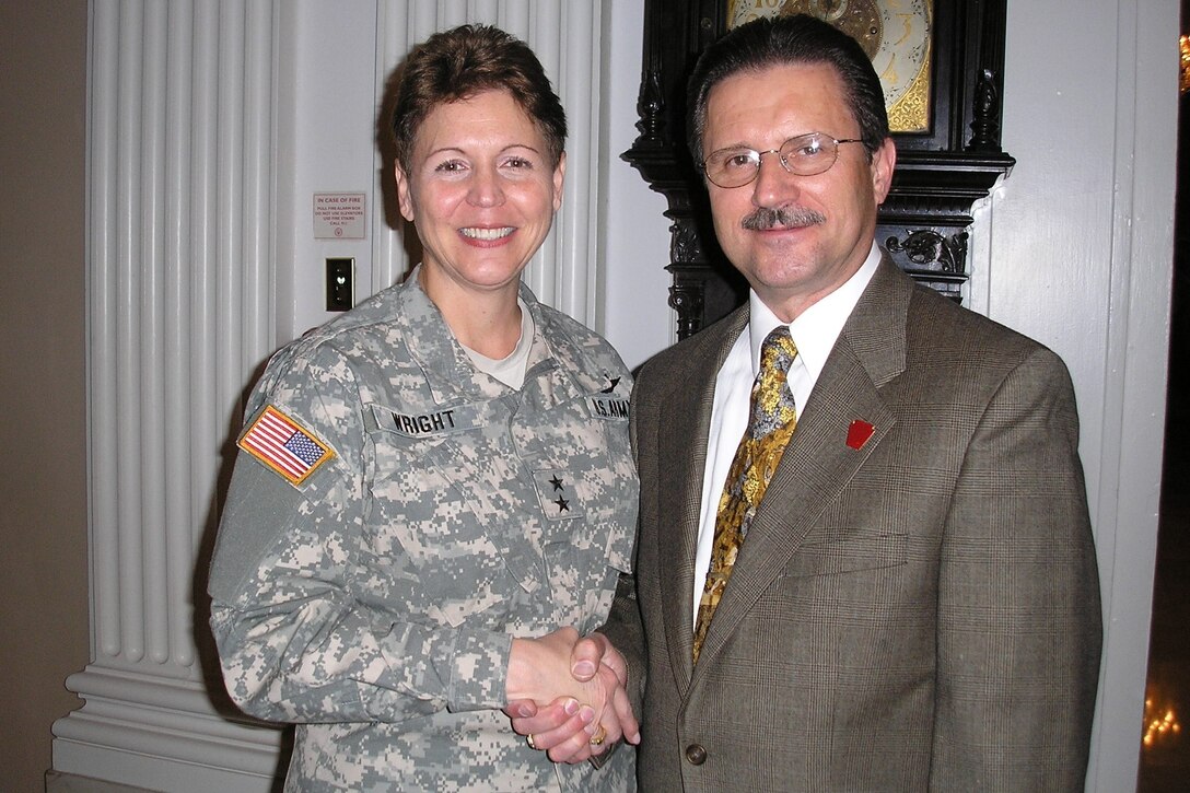 Roman Tymczyszyn, right, poses with then-Adjutant General Maj. Gen. Jessica Wright at Tymczyszyn's retirement ceremony in 2005 after Wright presented Tymczyszyn with a certificate promoting him to the rank of sergeant major. Tymczyszyn served in the Pennsylvania National Guard for 35 years, and for the last 18 years he has worked as a civilian contractor for recruiting. (Photo courtesy of Roman Tymczyszyn)