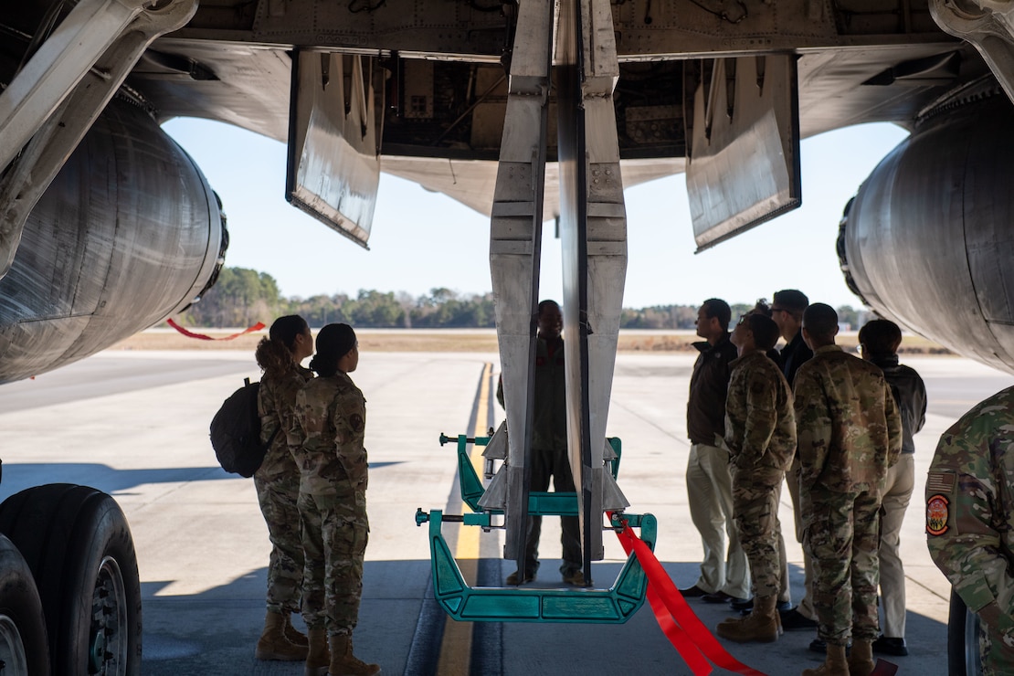 U.S. Air Force cadets learn about a B-1B Lancer assigned to the 9th Bomb Squadron during the third day of Accelerating the Legacy 2023 at Joint Base Charleston, South Carolina, Feb. 18, 2023.