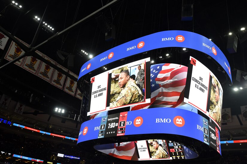 Chicago Bulls, National Basketball Association team, honors U.S. Army Reserve Sgt. 1st Class Cedrick Harding, of the 85th U.S. Army Reserve Support Command, on a jumbotron during a ‘Military Moment’ service recognition during a home game versus the Charlotte Hornets at the United Center, February 2, 2023, in Chicago.
