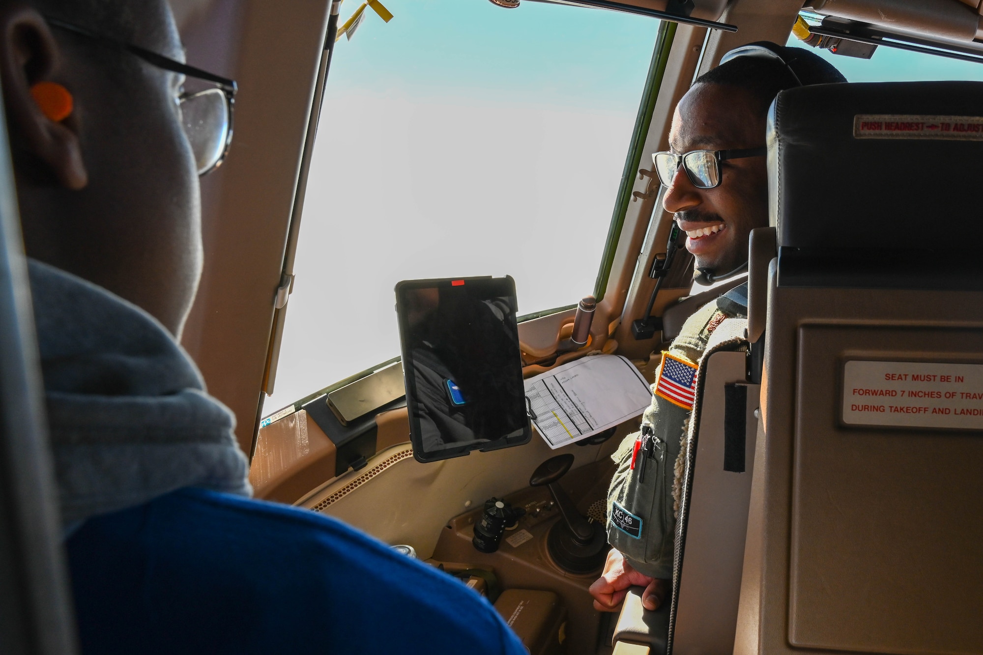 U.S. Air Force Maj. Ryan Smith, 56th Air Refueling Squadron instructor pilot, talks with a Legacy Flight Academy student on a KC-46 Pegasus during Accelerating the Legacy 2023 at Joint Base Charleston, South Carolina, Feb. 18, 2023. The event connects minority Airmen from various backgrounds and career fields in an attempt to broaden their perspectives and impart valuable career insight. (U.S. Air Force photo by Senior Airman Trenton Jancze)