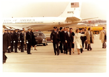 Carters and Mondales prepare to depart Andrews AFB after swearing in of President Ronald W. Reagan, as Honor Guard looks on.