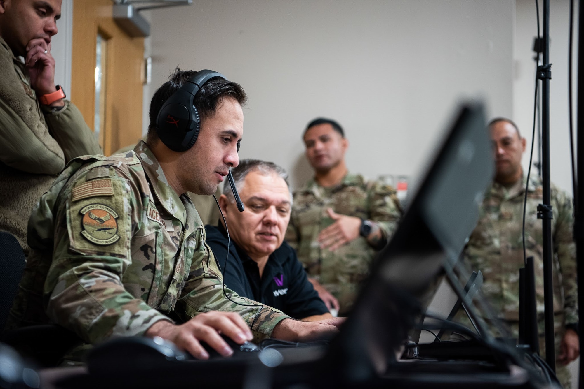 Tech. Sgt. Edwin Acevedo, 837th Training Squadron, looks at the computer screen while using the new SV-R simulator program at the Inter-American Air Forces Academy at Joint Base San Antonio-Lackland, Texas, Jan. 25, 2023. The simulator is among the newest equipment at the academy that will be used to train international military students from partner nations, focusing on counter narcotic efforts and combatting transnational criminal organizations. (U.S. Air Force photo by Vanessa R. Adame)