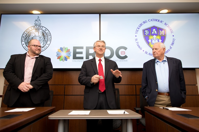 Christopher Williams, principal of Porter’s Chapel Academy; Dr. David Pittman, director U.S. Army Engineer Research and Development Center (ERDC); and Dr. Virgil “Buddy” Strickland, principal of Vicksburg Catholic School; sign educational partnership agreements on February 17, 2023. The agreements promote collaboration between ERDC and the schools.