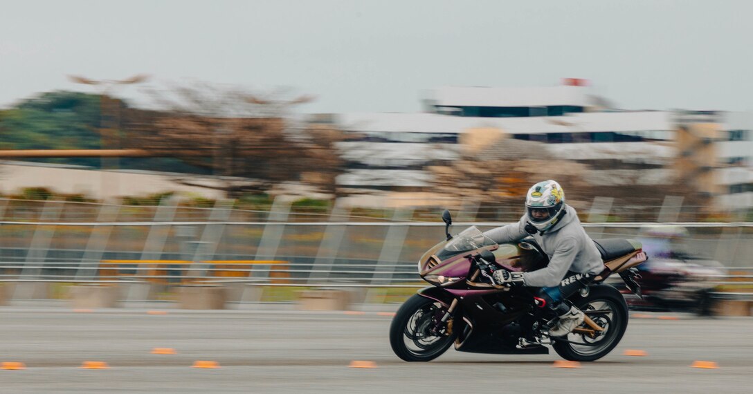 U.S. Air Force Staff Sgt. Jaire Rose, the noncommissioned officer in charge with 18th Maintenance Group, rides his motorcycle through a training circuit during the Advanced Rider Track Day training at Naha Port, Okinawa, Japan, on Feb. 11, 2023. An ARTD certificate is the highest level of training that Status of Forces Agreement personnel can be certified with while riding a motorcycle. The training was organized to further understand how to properly lean, accelerate, and stop the vehicle. The course also ensured that each attendee was comfortable with all advanced riding techniques to help promote road safety for both civilians and service members alike. (U.S. Marine Corps photo by Lance Cpl. Jonathan Beauchamp)
