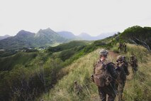 U.S. Marines with 3d Littoral Combat Team, 3d Marine Littoral Regiment, 3d Marine Division, move towards a simulated enemy location during an air assault training exercise at Marine Corps Training Area Bellows, Hawaii, Dec. 1, 2022. This training prepares the company for future airborne operations. (U.S. Marine Corps photo by Cpl. Brandon Aultman)