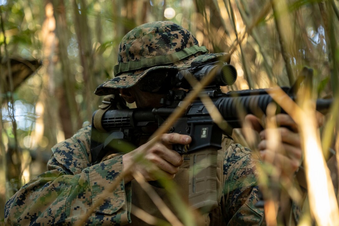 U.S. Marine Corps Lance Cpl. Bryce Hart with Headquarters Battalion, 3d Marine Division provides security during Exercise Samurai 23-1 in the Northern Training Area on Okinawa, Japan, Feb. 9, 2023.