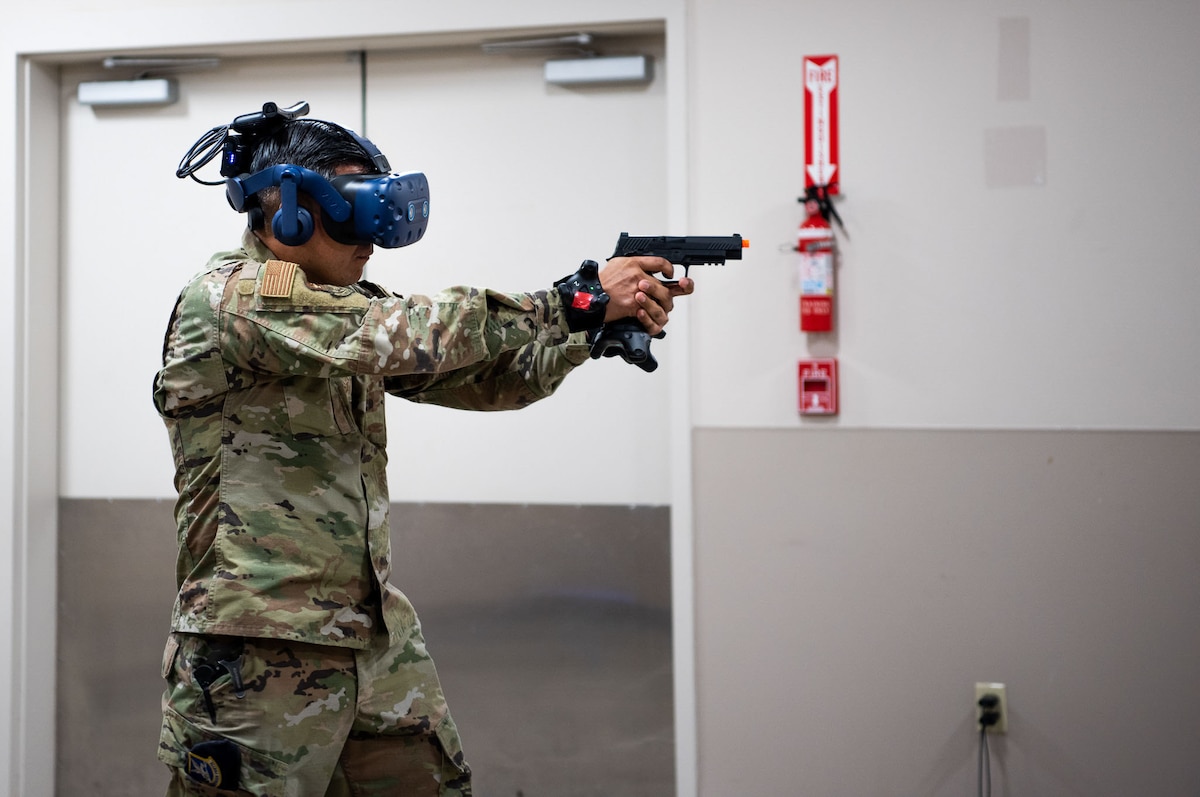 Master Sgt. Ricardo Alonso, IAAFA’s Chief of Standardization and Evaluation, grips a gun while using the new SV-R simulator at the Inter-American Air Forces Academy at Joint Base San Antonio-Lackland, Texas, Jan. 25, 2023. The simulator is among the newest equipment at the academy that will be used to train international military students from partner nations, focusing on counter narcotic efforts and combatting transnational criminal organizations. (U.S. Air Force photo by Vanessa R. Adame)