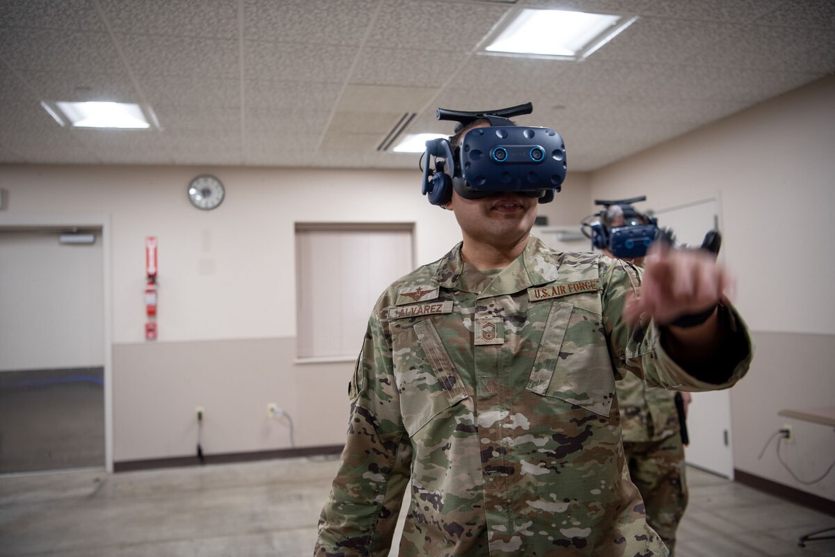 Senior Master Sgt. Victor Alvarez, 837th Training Squadron, points as he uses the new SV-R simulator at the Inter-American Air Forces Academy at Joint Base San Antonio-Lackland, Texas, Jan. 25, 2023. The simulator is among the newest equipment at the academy that will be used to train international military students from partner nations, focusing on counter narcotic efforts and combatting transnational criminal organizations. (U.S. Air Force photo by Vanessa R. Adame)