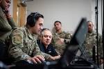 Tech. Sgt. Edwin Acevedo, 837th Training Squadron, looks at the computer screen while using the new SV-R simulator program at the Inter-American Air Forces Academy at Joint Base San Antonio-Lackland, Texas, Jan. 25, 2023. The simulator is among the newest equipment at the academy that will be used to train international military students from partner nations, focusing on counter narcotic efforts and combatting transnational criminal organizations. (U.S. Air Force photo by Vanessa R. Adame)