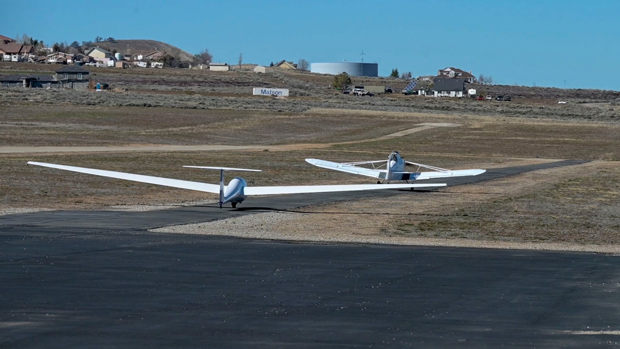 A student departs on a glider from Skylark North Glider School to begin the Space Test Course. To celebrate National Engineering Week, the United States Air Force Test Pilot School based at Edwards Air Force Base went to Tehachapi, California to fly mountain gliders to simulate space shuttle approaches.