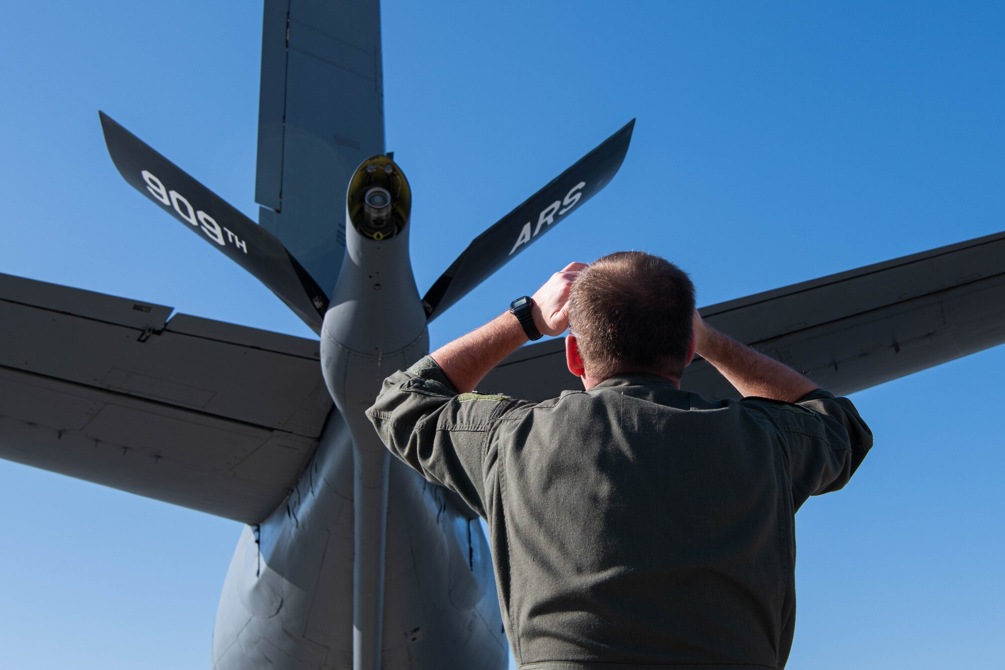 Pilot inspects plane