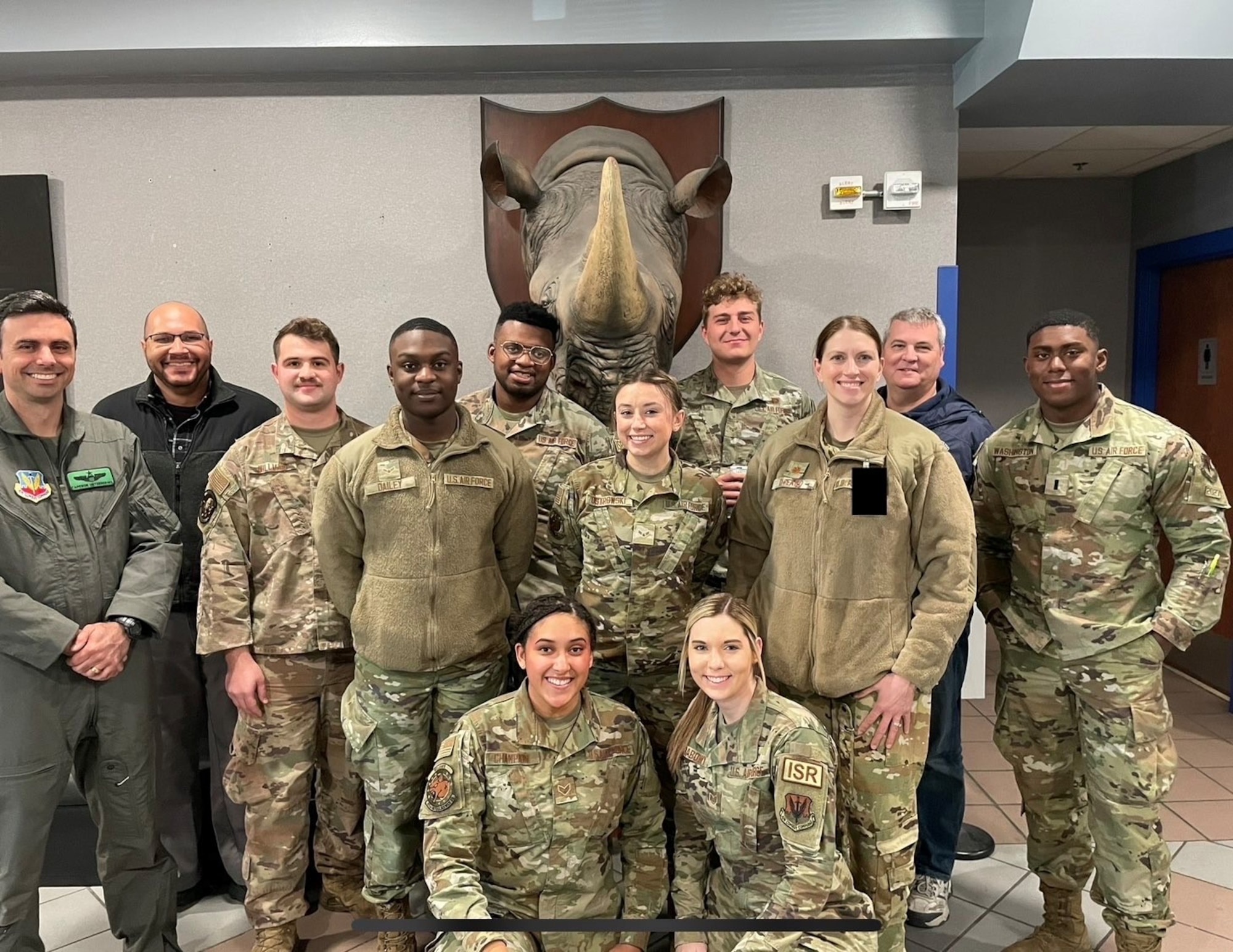 U.S. Air Force members from the 39th Electronic Warfare Squadron and 453rd EWS pose for a group photo while attending Red Flag 23-1 at Nellis Air Force Base, Nev., Jan. 25, 2023. The 39th EWS and 453rd EWS both attended Red Flag 23-1 to support the Intelligence, Surveillance and Reconnaissance mission for units participating. (U.S. Air Force photo by 1st Lt. Benjamin Aronson) (This photo has been altered for security purposes by blurring out a security badge.)