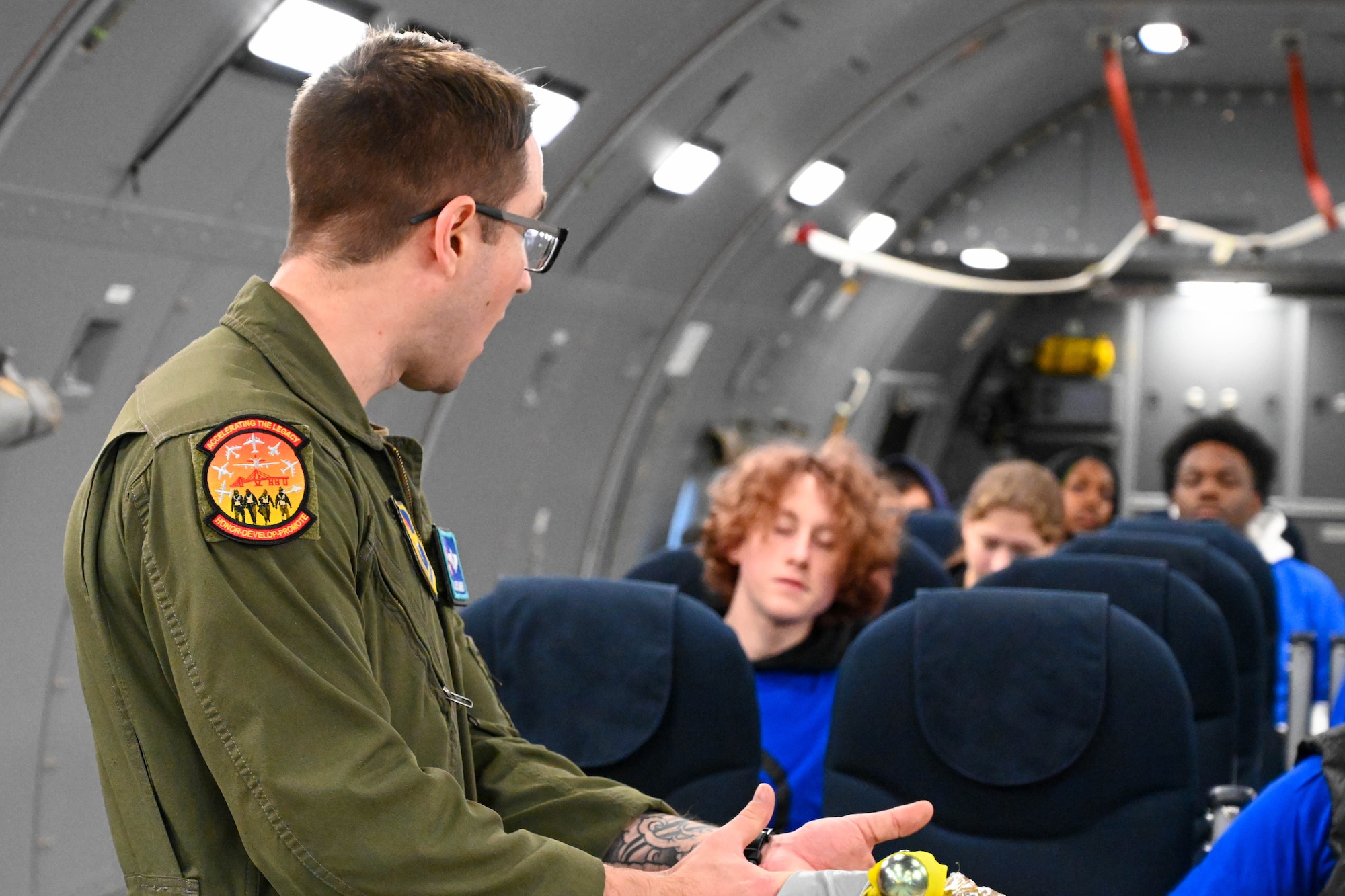 U.S. Air Force Tech. Sgt. Jesse Barber, 56th Air Refueling Squadron boom operator instructor, gives a pre-flight brief to Legacy Flight Academy students at Joint Base Charleston, South Carolina, Feb. 18, 2023. The students spent the day enhancing their STEM knowledge and learning about aerospace-focused military career opportunities. (U.S. Air Force photo by Senior Airman Trenton Jancze)