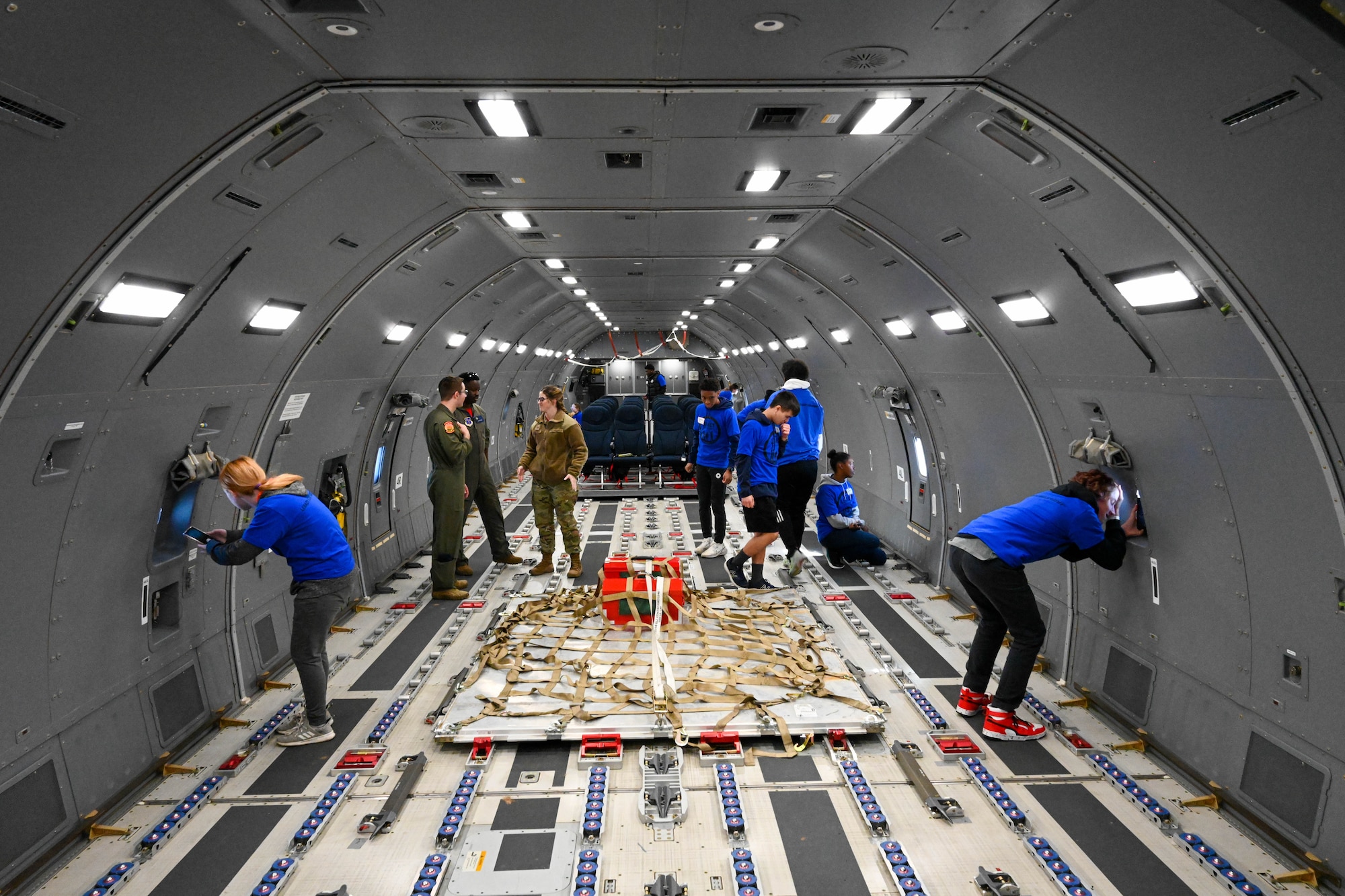 Legacy Flight Academy students explore the cargo area of a KC-46 Pegasus at Joint Base (JB) Charleston, South Carolina, Feb. 18, 2023. The students spent the day on the JB Charleston flightline interacting with Airmen and exploring several different Air Force aircraft. (U.S. Air Force photo by Senior Airman Trenton Jancze)