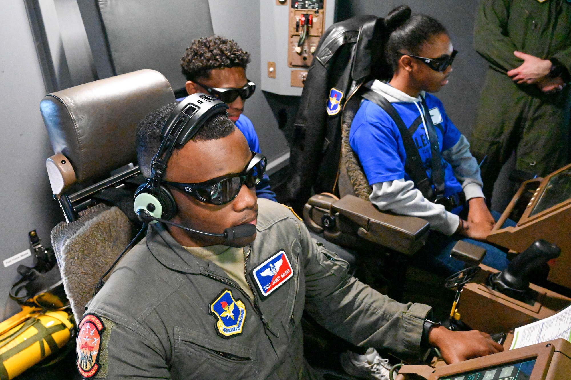 U.S. Air Force Tech. Sgt. James Walker, 56th Air Refueling Squadron boom operator instructor, shows a 3D display to Legacy Flight Academy students at Joint Base Charleston, South Carolina, Feb. 18, 2023. Local elementary, middle and high school students spent the day touring various Air Force aircraft and flying in Civil Air Patrol and U.S. Air Force aircraft. (U.S. Air Force photo by Senior Airman Trenton Jancze)