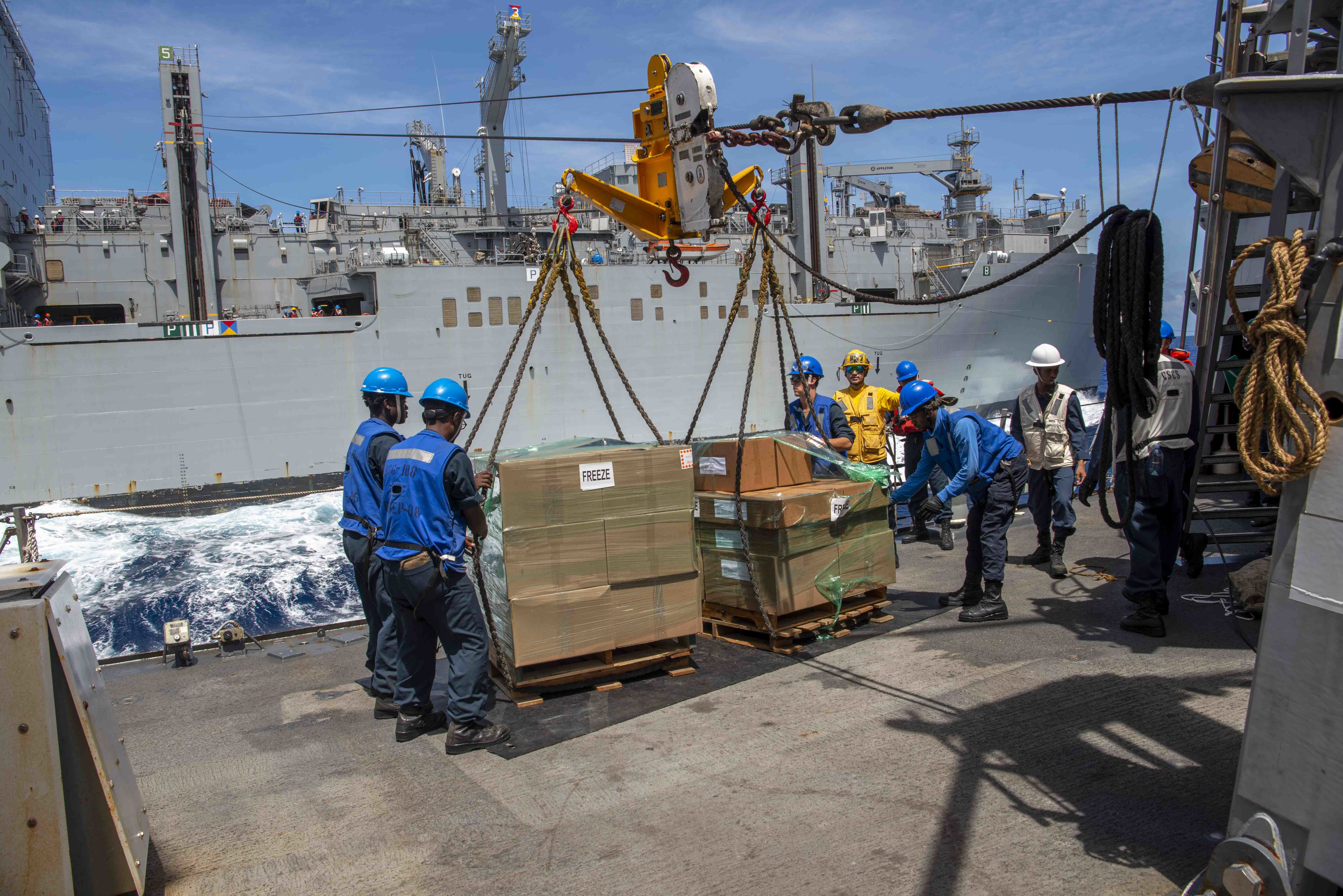 U.S. Navy Sailors receive stores aboard the Arleigh Burke-class guided-missile destroyer USS Wayne E. Meyer (DDG 108) during an underway replenishment with the fleet dry cargo ship USNS Wally Schirra (T-AKE 8).