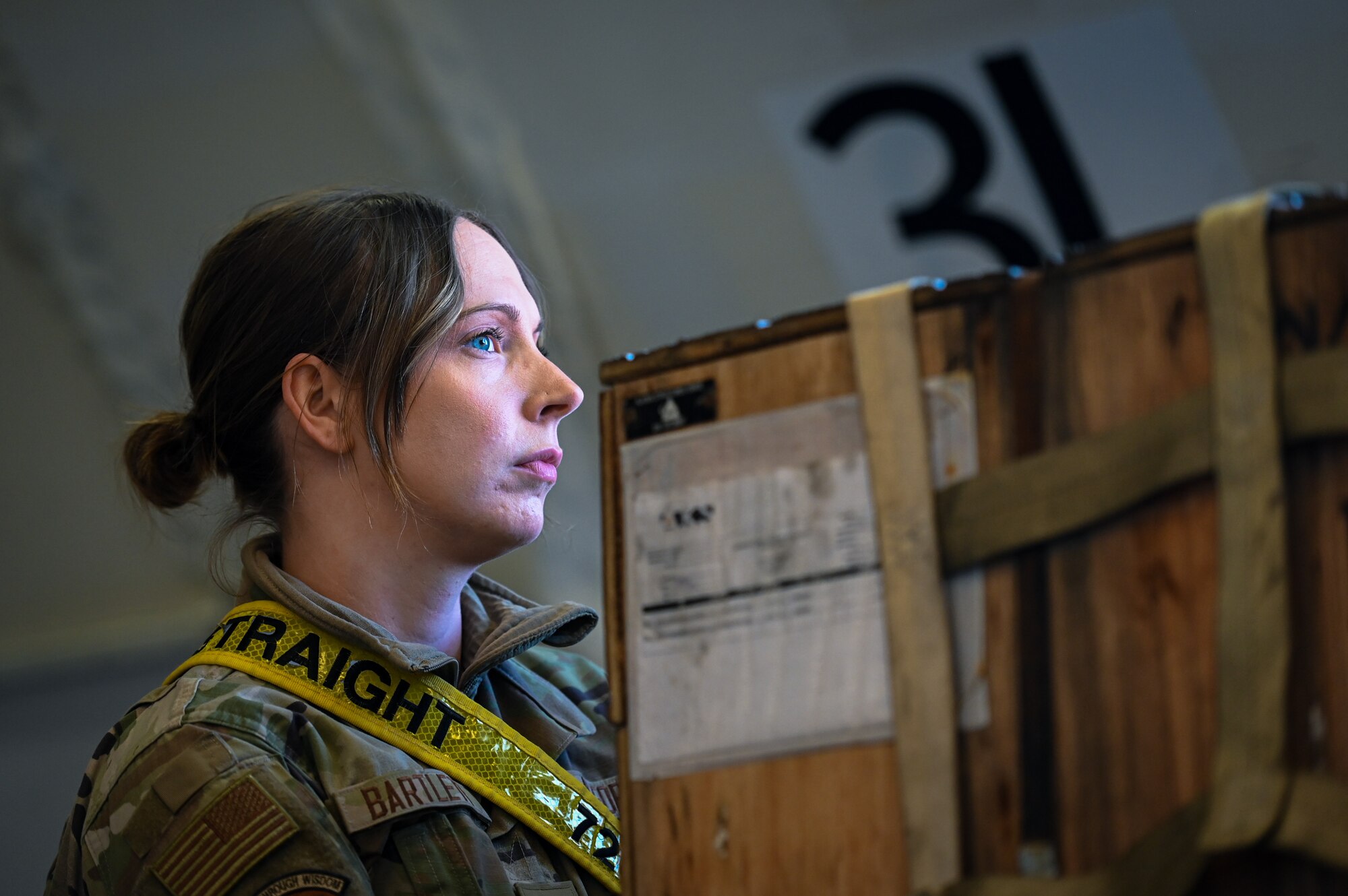 Airman 1st Class Kaylan Bartlett, an aircraft services technician assigned to the 728th Air Mobility Squadron, prepares to unload medical shelters and equipment at Incirlik Air Base, Türkiye, Feb. 18, 2023.