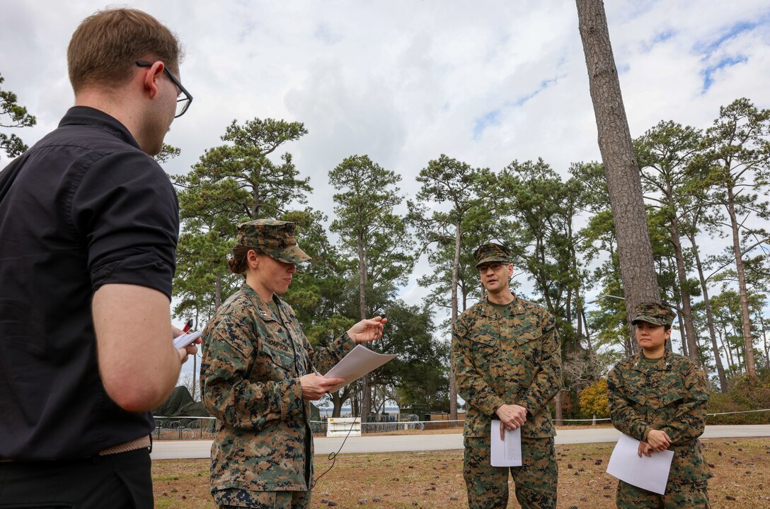 U.S. Marines with II Marine Expeditionary Force conduct a training press conference with Communication Strategy and Operations Marines during Marine Expeditionary Force Exercise-23, Marine Corps Base Camp Lejeune, North Carolina, Feb. 16, 2023. MEFEX is an exercise that develops command and control capabilities and warfighting functions of the MEF staff as an operational command in preparation for crisis across the spectrum of conflict. In the scenario, MEF staff developed the ability to coordinate with non-governmental organizations, U. S. Agency for International Development, and other agencies in response to a foreign humanitarian crisis.