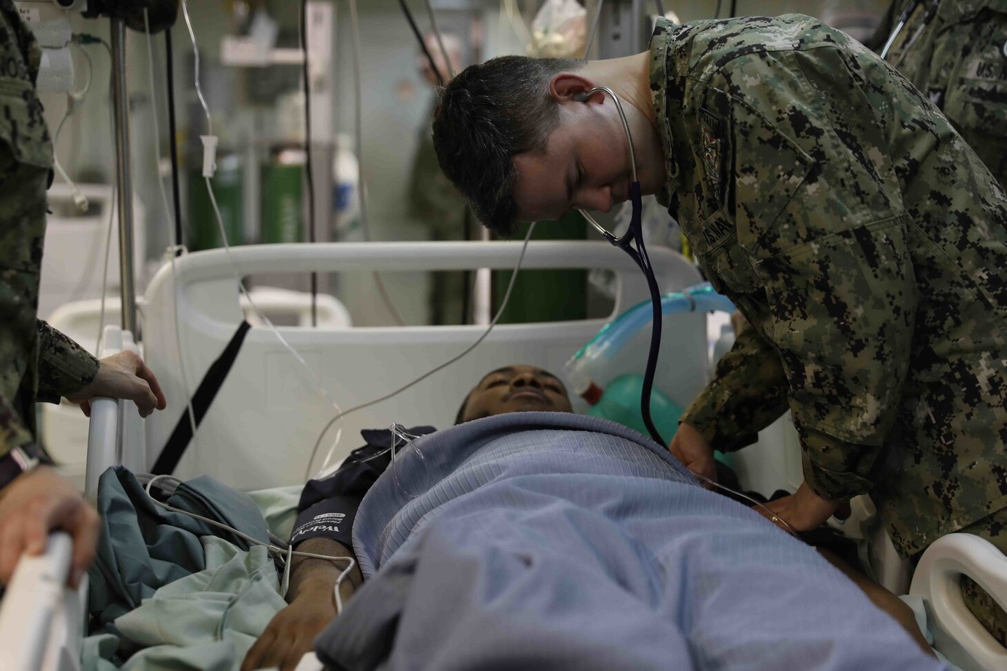 NORFOLK, Va. (Feb. 16, 2023) Wasp-class amphibious assault ship USS Bataan (LHD 5) Internal Medicine Doctor Lt. Thomas Brooke examines Hospital Corpsman 2nd Class Farrie Jalin as part of a pier-side trauma training exercise, Feb. 16, 2023. The evolution was conducted as part of a Naval Medical Forces Atlantic and U.S. Fleet Forces Command-driven effort to align with and support fleet and joint requirements, and to improve deployment readiness of organic fleet medical departments. During the evolution, the ship’s medical staff participated in several medical scenarios and received real-time feedback in order to build enhanced knowledge and skillsets. (U.S. Navy photo by Mass Communication Specialist 2nd Class Darren Newell)