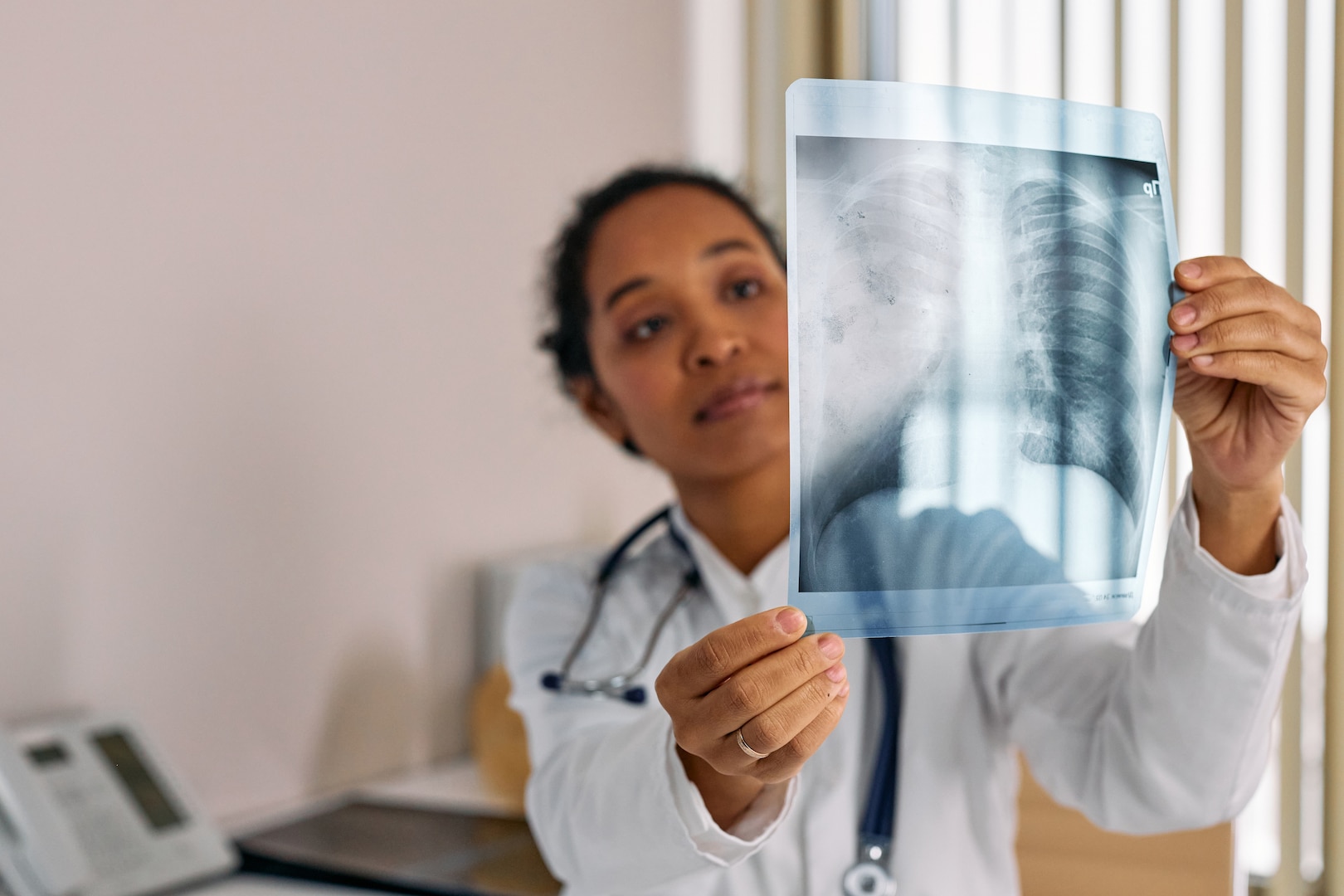 Doctor looks at X-ray