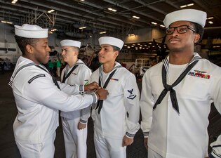 USS George H.W. Bush (CVN 77) holds a dress white uniform inspection in the Adriatic Sea.