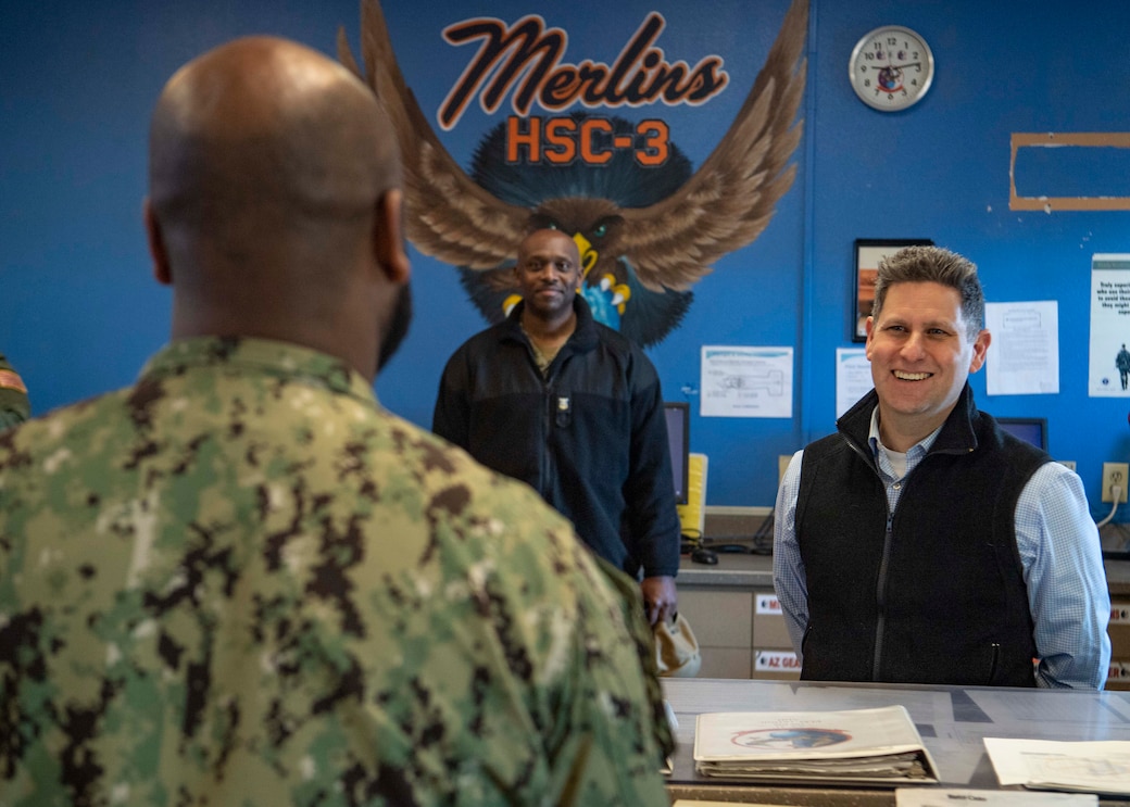 Assistant Secretary of the Navy (ASN) for Financial Management and Comptroller (FM&C) Russell Rumbaugh, right, interacts with Sailors assigned to the “Merlins” of Helicopter Sea Combat Squadron (HSC) 3 in maintenance control, during a tour of HSC-3 squadron spaces aboard Naval Air Station, North Island, Feb. 15, 2023. In addition to operational subjects, Rumbaugh had the opportunity to engage directly with HSC-3 Sailors and answer questions they had regarding quality of life topics, such expansion of child development centers, accessibility of healthcare and availability of mental health resources. HSC-3 is the Navy’s West Coast MH-60S fleet replacement squadron, responsible for training pilots and aircrewmen by providing the most capable warfighters to the Fleet.