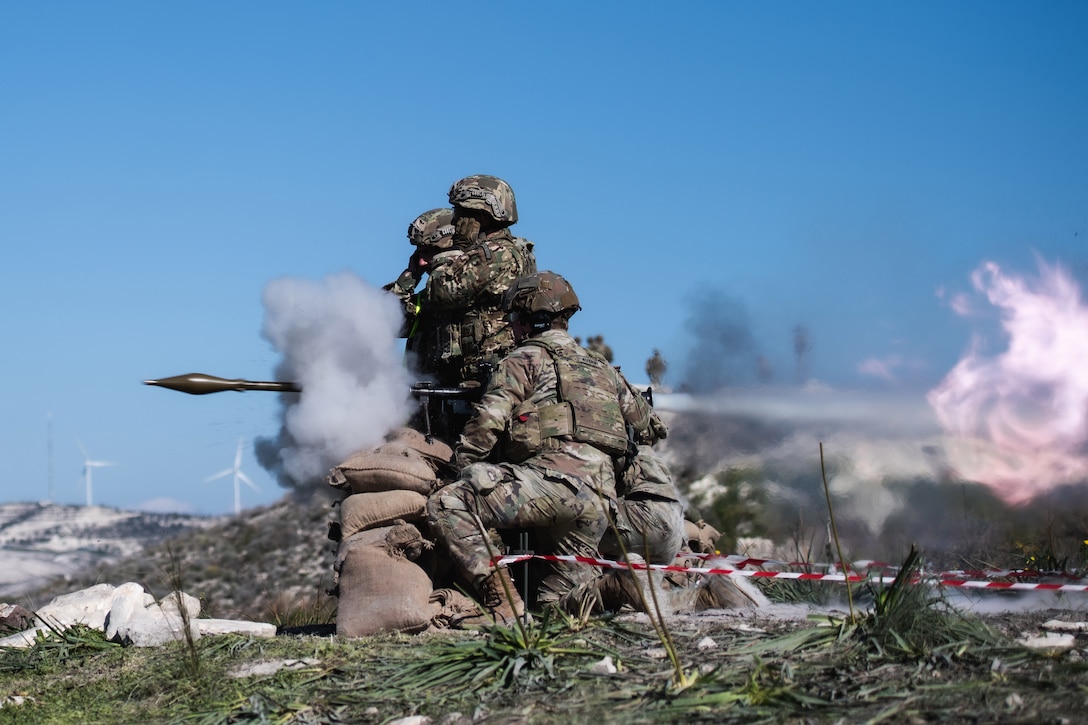 Service members fire a rocket propelled grenade launcher during training.