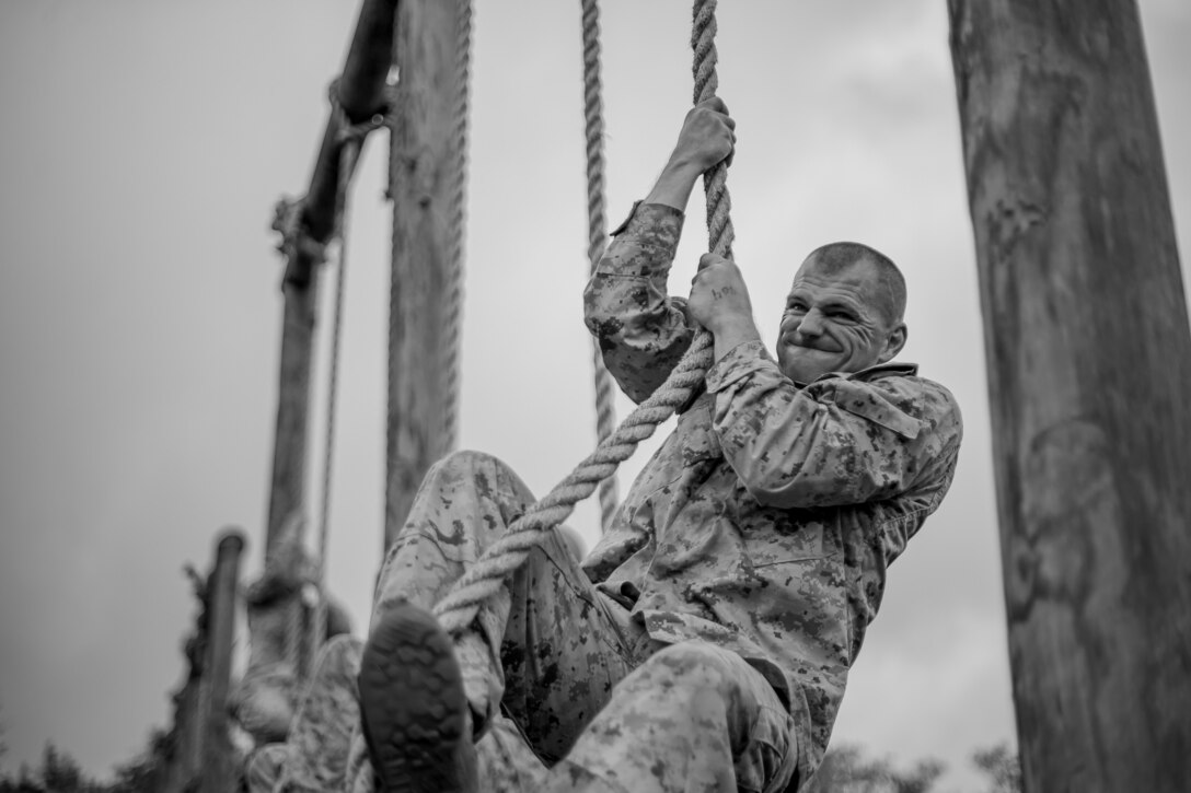 Candidates from Co. A and D, OCC-242 navigate through the Obstacle Course. The purpose of the Obstacle Course is to test the candidate’s ability to negotiate obstacles using the correct techniques while displaying a high level of agility, muscular strength, and stamina. (U.S. Marine Corps photo by Sgt Gumchol Cho)