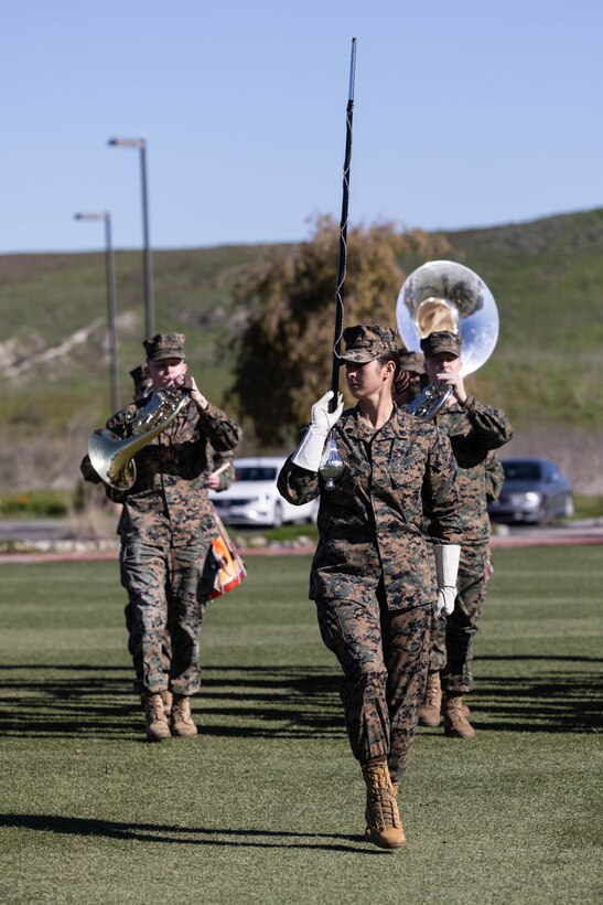 U.S. Marine Staff Sgt. Jessica Larsen, the 1st Marine Division Band drum major, instructs band members during rehearsal at Marine Corps Base Camp Pendleton, California, Jan. 24, 2023. Larsen’s first duty station was at the Blue Diamond as a lance corporal saxophone instrumentalist, and now after three years as a drill instructor, she has returned for a second tour. Larsen is a native of Saint Donatus, Iowa.  (U.S. Marine Corps photo by Cpl. Cameron Hermanet)