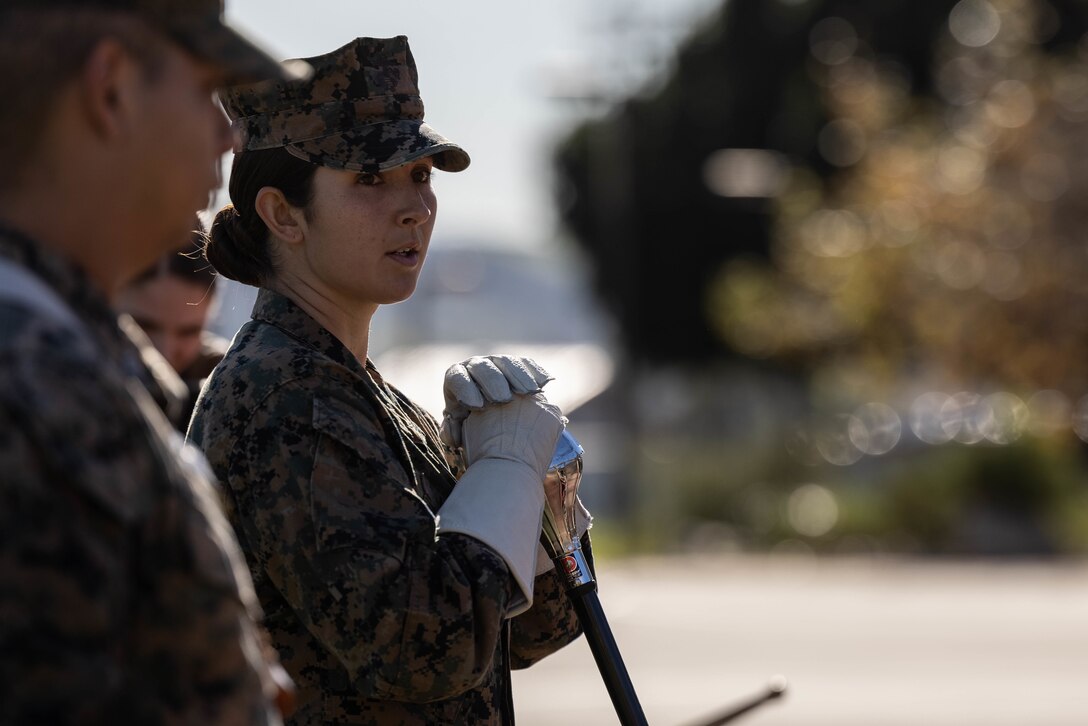 U.S. Marine Staff Sgt. Jessica Larsen, the 1st Marine Division Band drum major, instructs band members during rehearsal at Marine Corps Base Camp Pendleton, California, Jan. 24, 2023. Larsen’s first duty station was at the Blue Diamond as a lance corporal saxophone instrumentalist, and now after three years as a drill instructor, she has returned for a second tour. Larsen is a native of Saint Donatus, Iowa. (U.S. Marine Corps photo by Cpl. Cameron Hermanet)