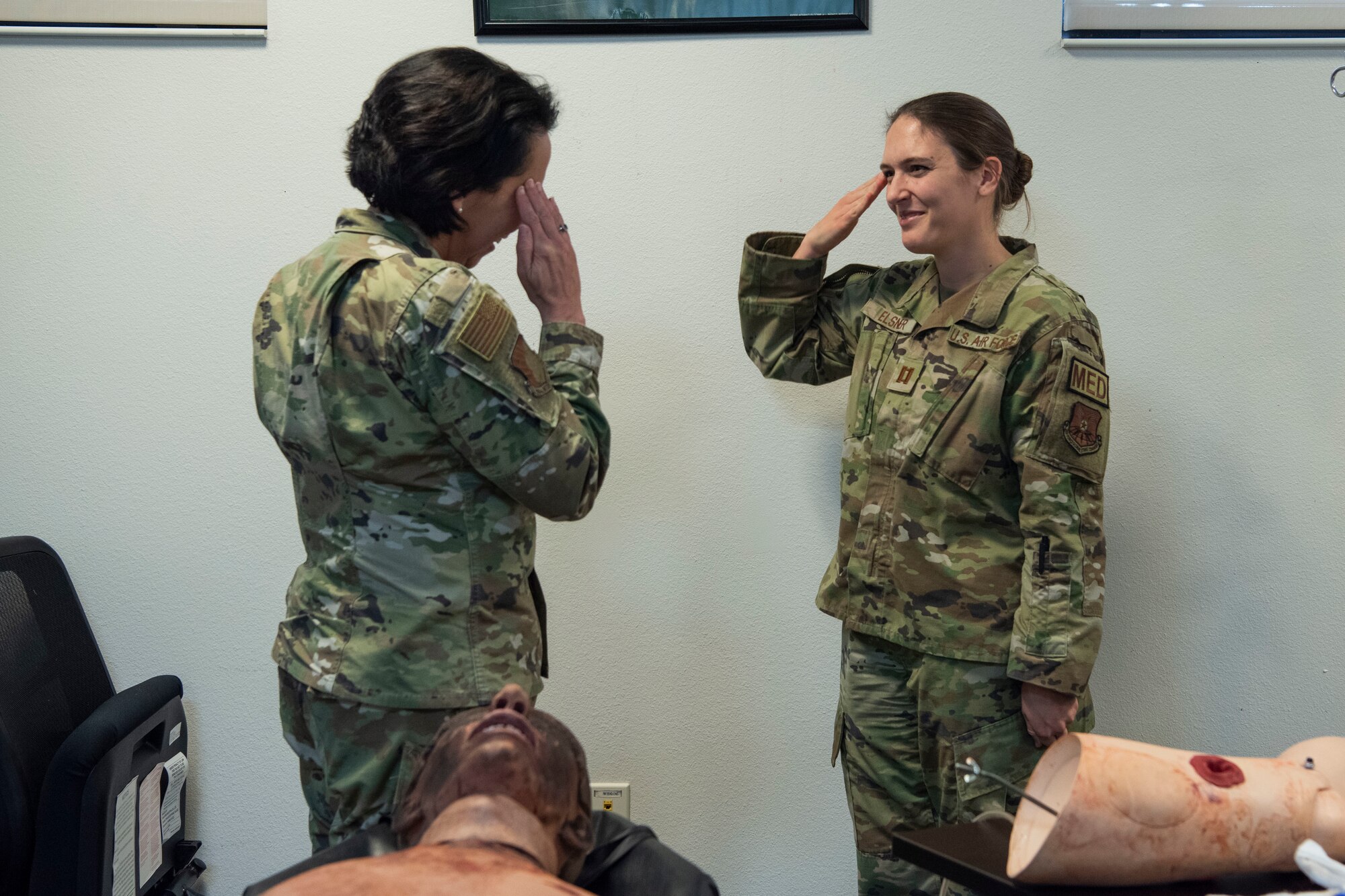 Capt. Allison Elsner, 7th Medical Group education and training clinical nurse, salutes Brig. Gen. Jeannine Ryder, 59th Medical Wing commander and chief of the Air Force Nurse Corps, at Dyess Air Force Base, Texas, February 22, 2023. Ryder and Chief Master Sgt. Taliah Wilkerson, Air Force Readiness Agency's Aerospace Medical Service and Surgical Service Career Field Manager, provided a strategic overview and future posture of the Total Nursing Force at the 7th MDG, while also learning about the different mission sets by the Airmen. (U.S. Air Force photo by Airman 1st Class Alondra Cristobal Hernandez)