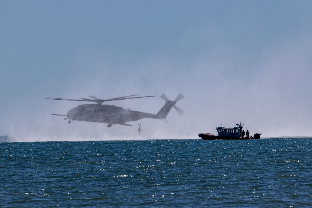 A U.S. Marine Corps CH-53E Super Stallion with Marine Medium Tiltrotor Squadron (VMM) 162 (Reinforced), drops off Marines with Alpha Company, 2nd Reconnaissance Battalion, during helocast water insert training on Marine Corps Base Camp Lejeune, North Carolina, Feb. 14, 2023. Helocasting is an airborne technique that allows Marines to stealthily insert from a helicopter into any body of water, subsequently utilizing Combat Rubber Raiding Craft to conduct amphibious beach reconnaissance and raids. Assisting in this training shows the capability of the MEU to conduct an insert of ground forces by sea. (U.S. Marine Corps photo by Lance Cpl. Rafael Brambila-Pelayo)