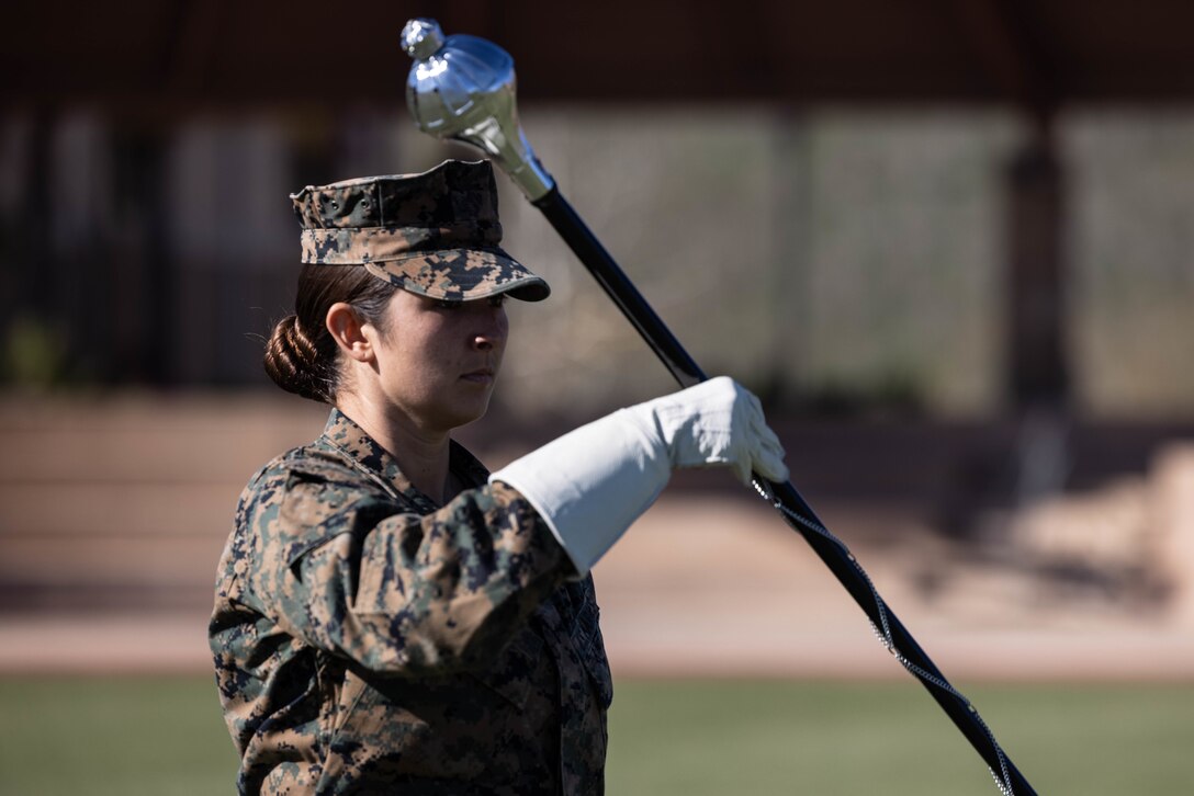 U.S. Marine Staff Sgt. Jessica Larsen, the 1st Marine Division Band drum major, instructs band members during rehearsal at Marine Corps Base Camp Pendleton, California, Jan. 24, 2023. Larsen’s first duty station was at the Blue Diamond as a lance corporal saxophone instrumentalist, and now after three years as a drill instructor, she has returned for a second tour. Larsen is a native of Saint Donatus, Iowa.  (U.S. Marine Corps photo by Cpl. Cameron Hermanet)