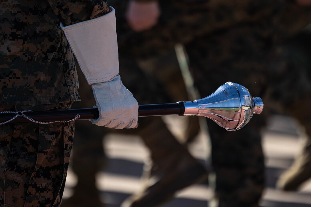 U.S. Marine Staff Sgt. Jessica Larsen, the 1st Marine Division Band drum major, instructs band members during rehearsal at Marine Corps Base Camp Pendleton, California, Jan. 24, 2023. Larsen’s first duty station was at the Blue Diamond as a lance corporal saxophone instrumentalist, and now after three years as a drill instructor, she has returned for a second tour. Larsen is a native of Saint Donatus, Iowa.  (U.S. Marine Corps photo by Cpl. Cameron Hermanet)