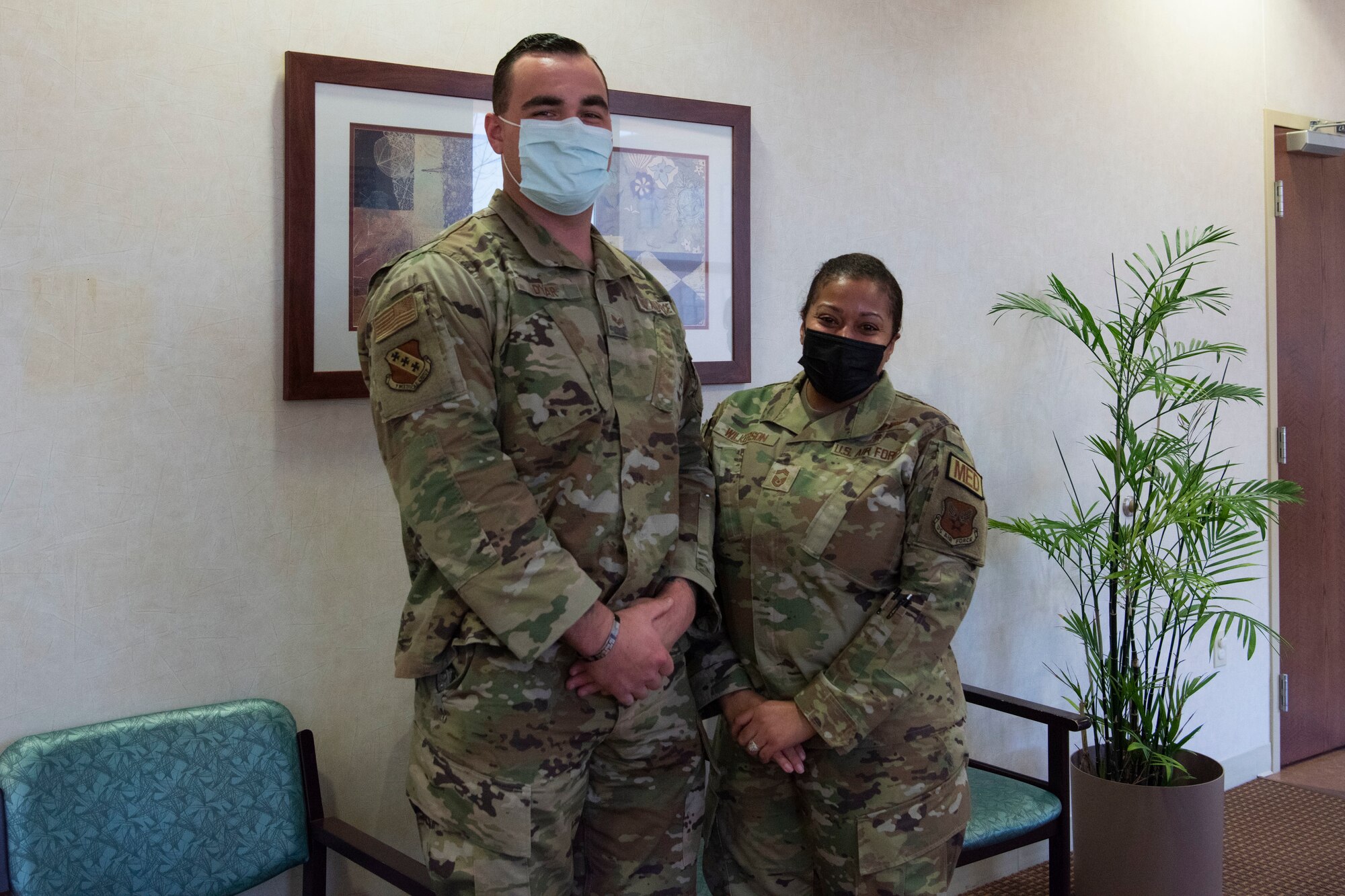 Chief Master Sgt. Taliah Wilkerson, Air Force Readiness Agency's Aerospace Medical Service and Surgical Service Career Field Manager, poses with Senior Airman Dillon Dyar, 7th Operational Medical Readiness Squadron flight medicine independent duty medical technician, during her visit at Dyess Air Force Base, Texas, February 22, 2023. Brigadier General Jeannine Ryder, 59th Medical Wing commander and chief of the Air Force Nurse Corps, and Wilkerson provided a strategic overview and future posture of the Total Nursing Force at the 7th Medical Group, while also learning about the different mission sets by the Airmen. (U.S. Air Force photo by Airman 1st Class Alondra Cristobal Hernandez)