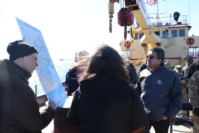 Honorable Michael L. Connor, Assistant Secretary of the Army for Civil Works, listens on as members of the U.S. Army Corps of Engineers New York District explains the district’s operations in New York Harbor aboard the drift collection vessel Hayward