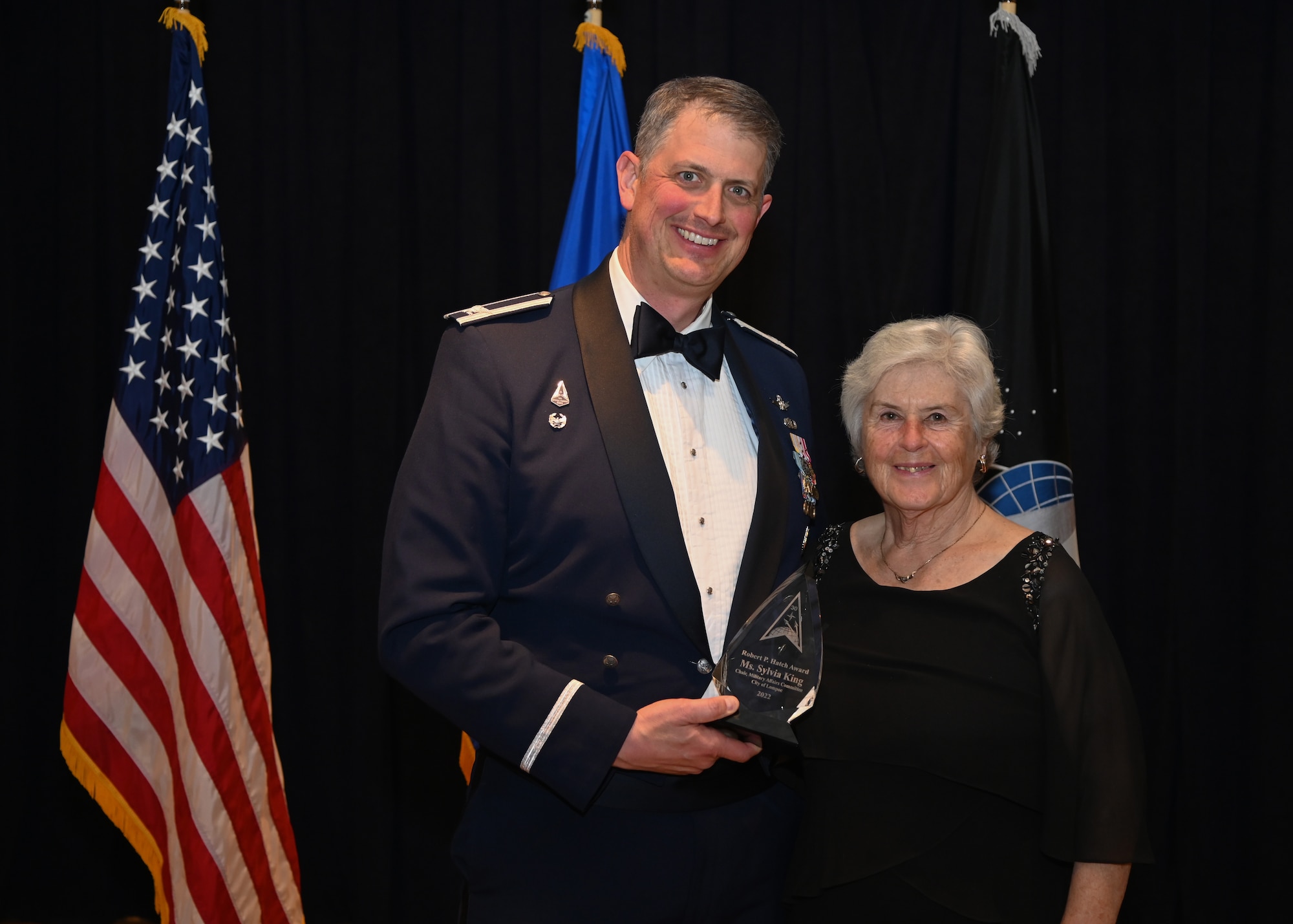 U.S. Space Force Col. Robert Long, Space Launch Delta 30 commander, poses for a photo with Ms. Sylvia King, chair, Military Affairs Committee Lompoc during the Space Launch Delta 30 Annual Awards ceremony at the Pacific Coast Club on Vandenberg Space Force Base, Calif., Feb. 16, 2023. Airmen, Guardians, and civilian employees were honored and recognized for their hard work in their communities and work centers. (U.S. Space Force photo by Airman 1st Class Ryan Quijas)